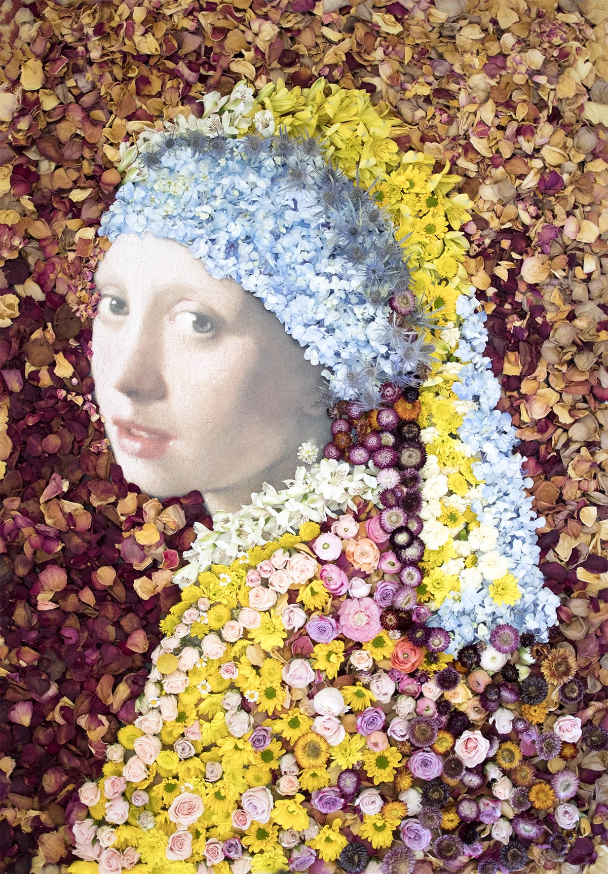 Photo of girl with yellow bandana and pearl earring, surrounded by flowers