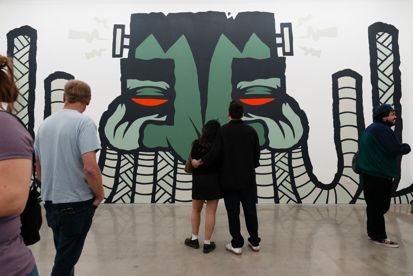 Group of people looking at GATS mural at Hashimoto Contemporary LA