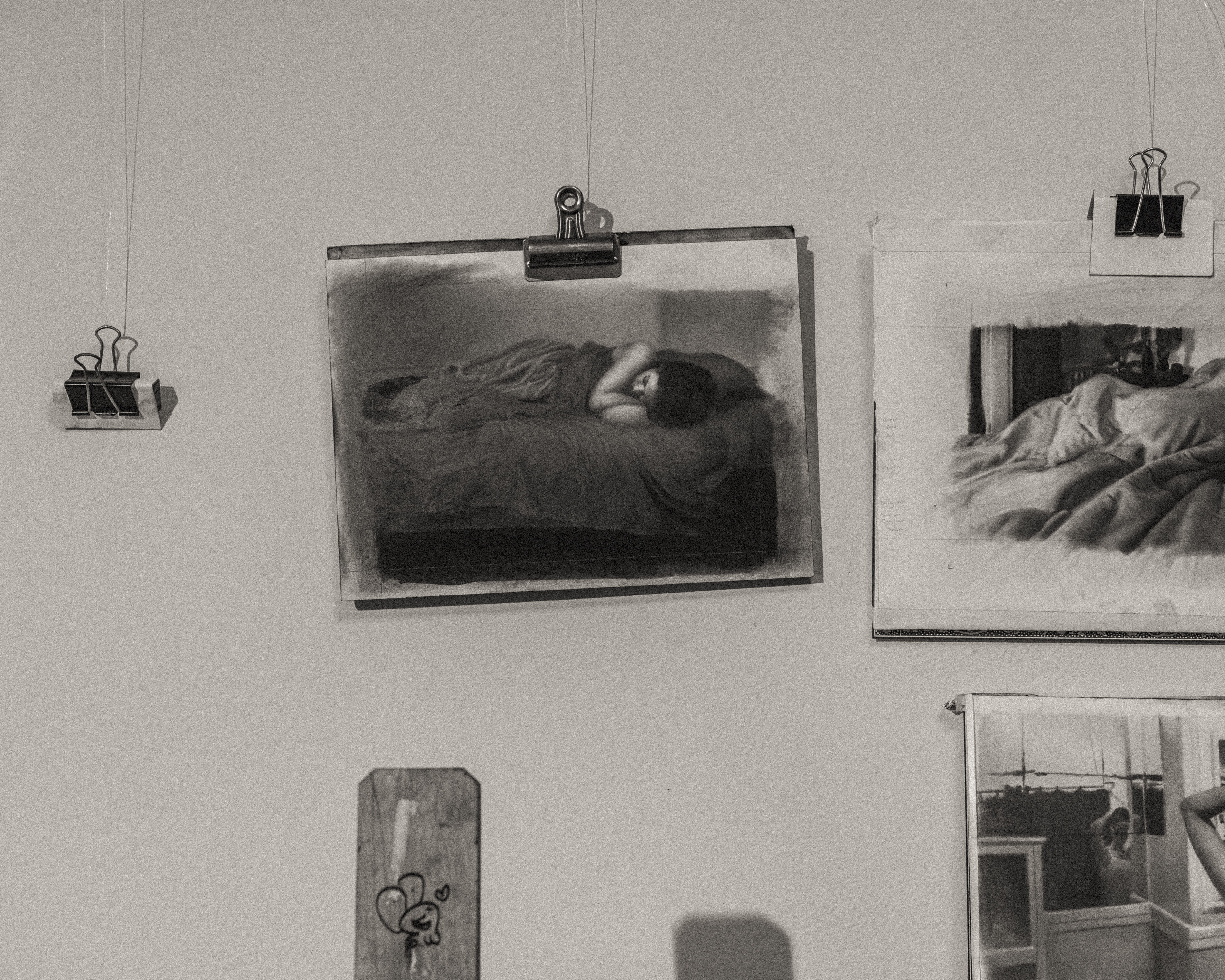 Black and White photo of wall with drawings in Zachary Oldenkamp's studio