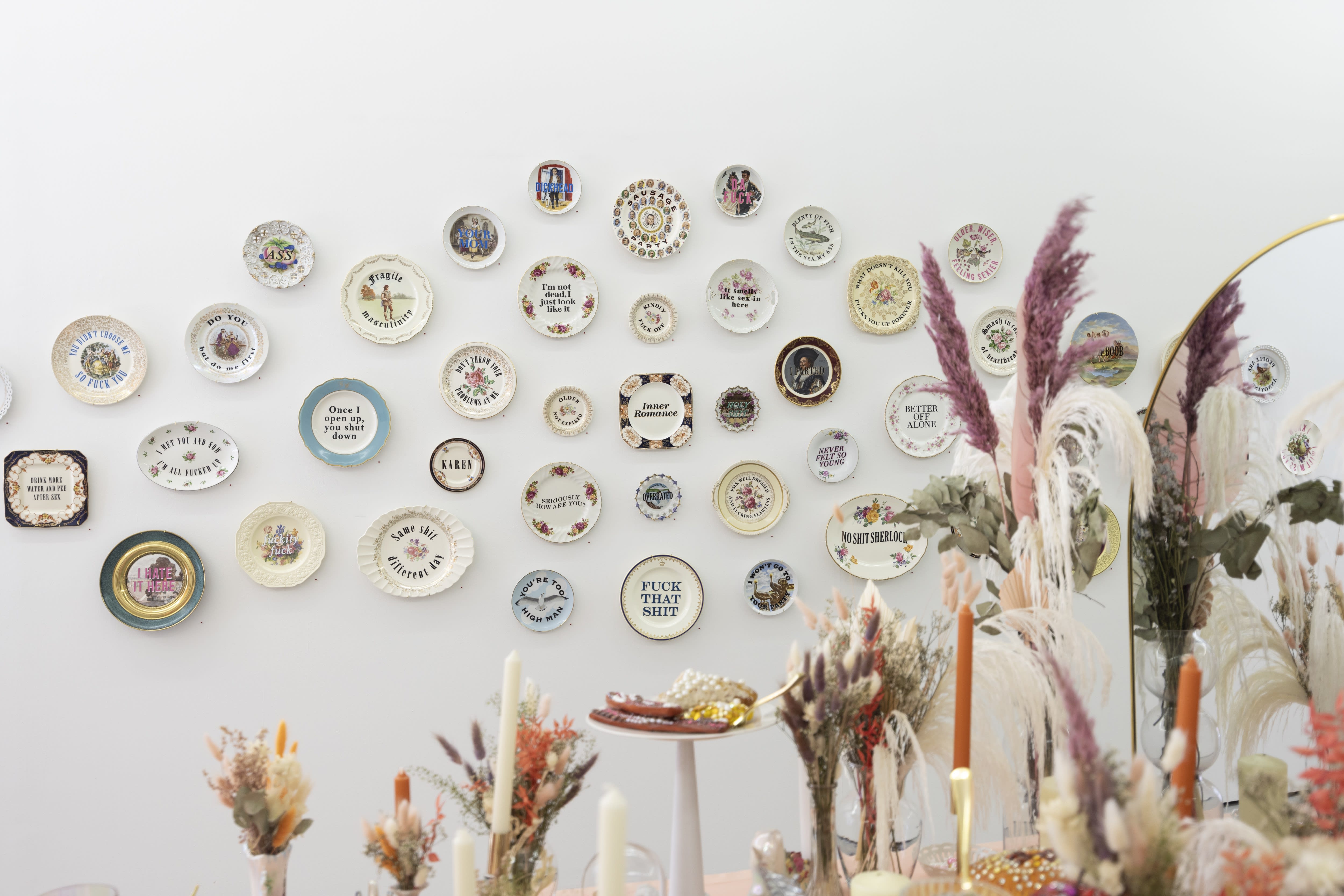 Photo of plates designed by Marie Claude Marquis on a white wall