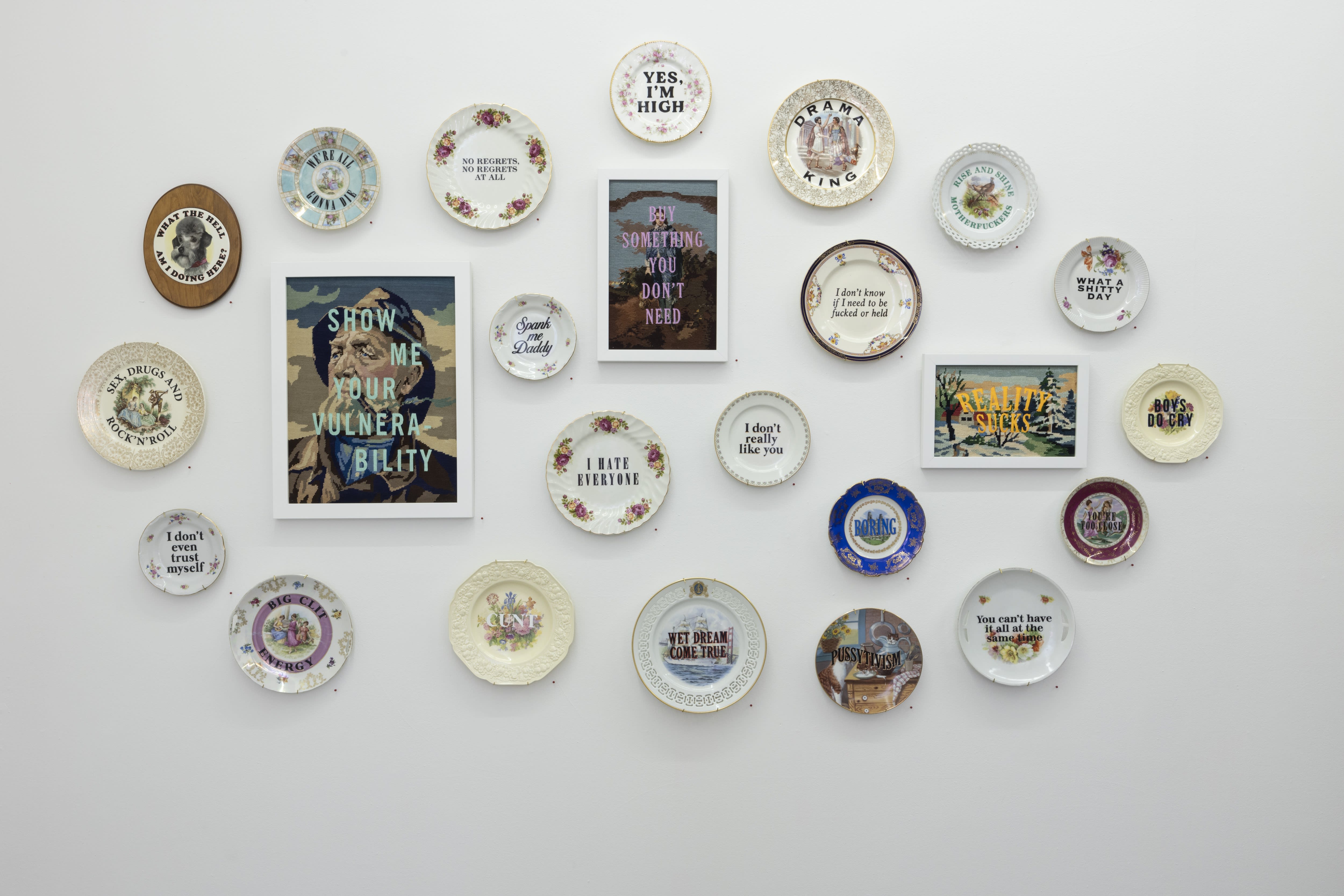 Installation shot of plates on a wall designed by Marie Claude Marquis