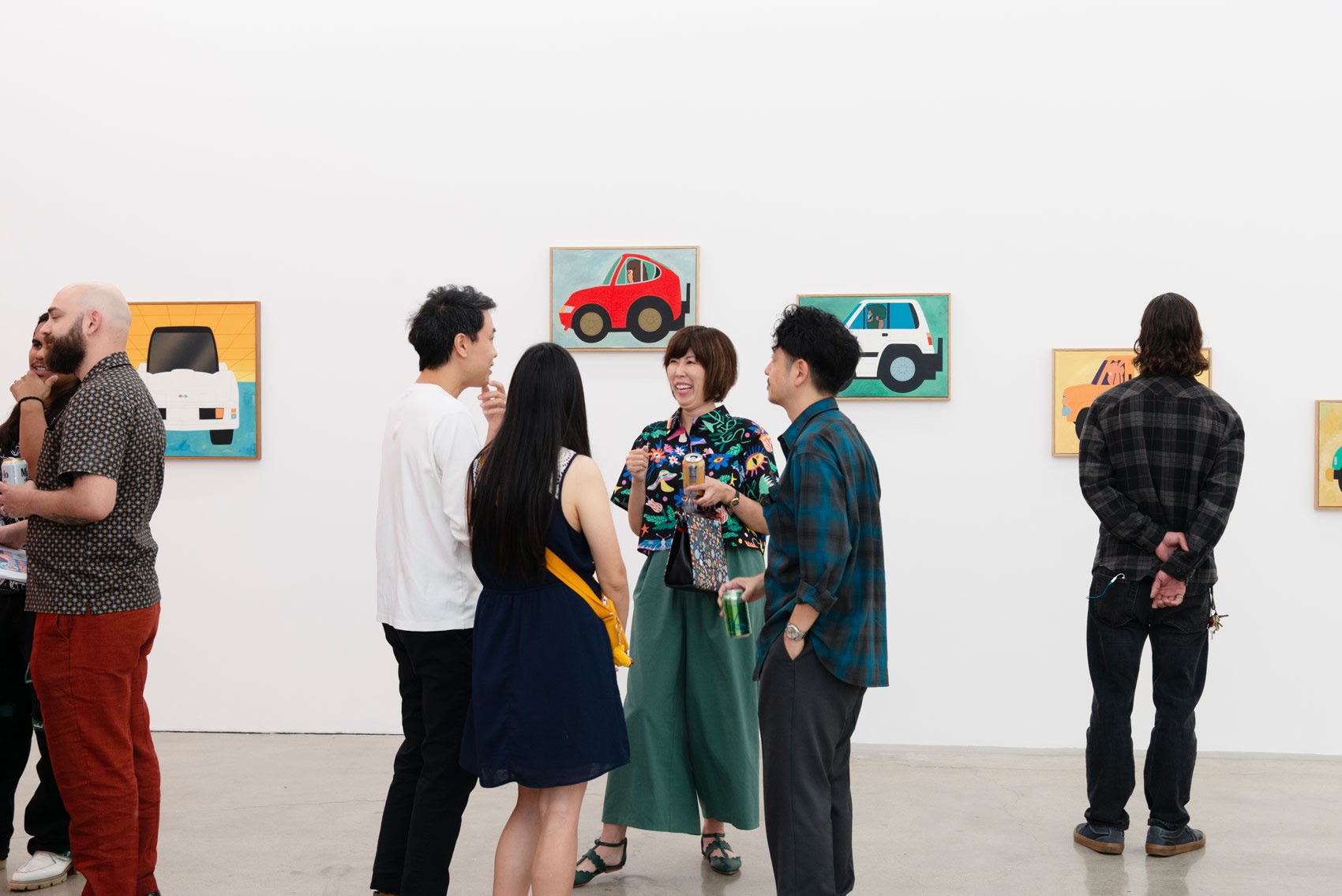 People in the gallery at the opening reception for Jun Oson and Keya Tama