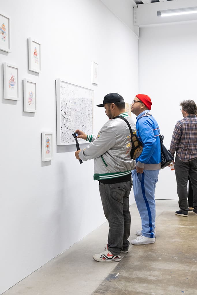 Photo from the opening reception of artist duo KeFe's opening reception for their show Music Island.