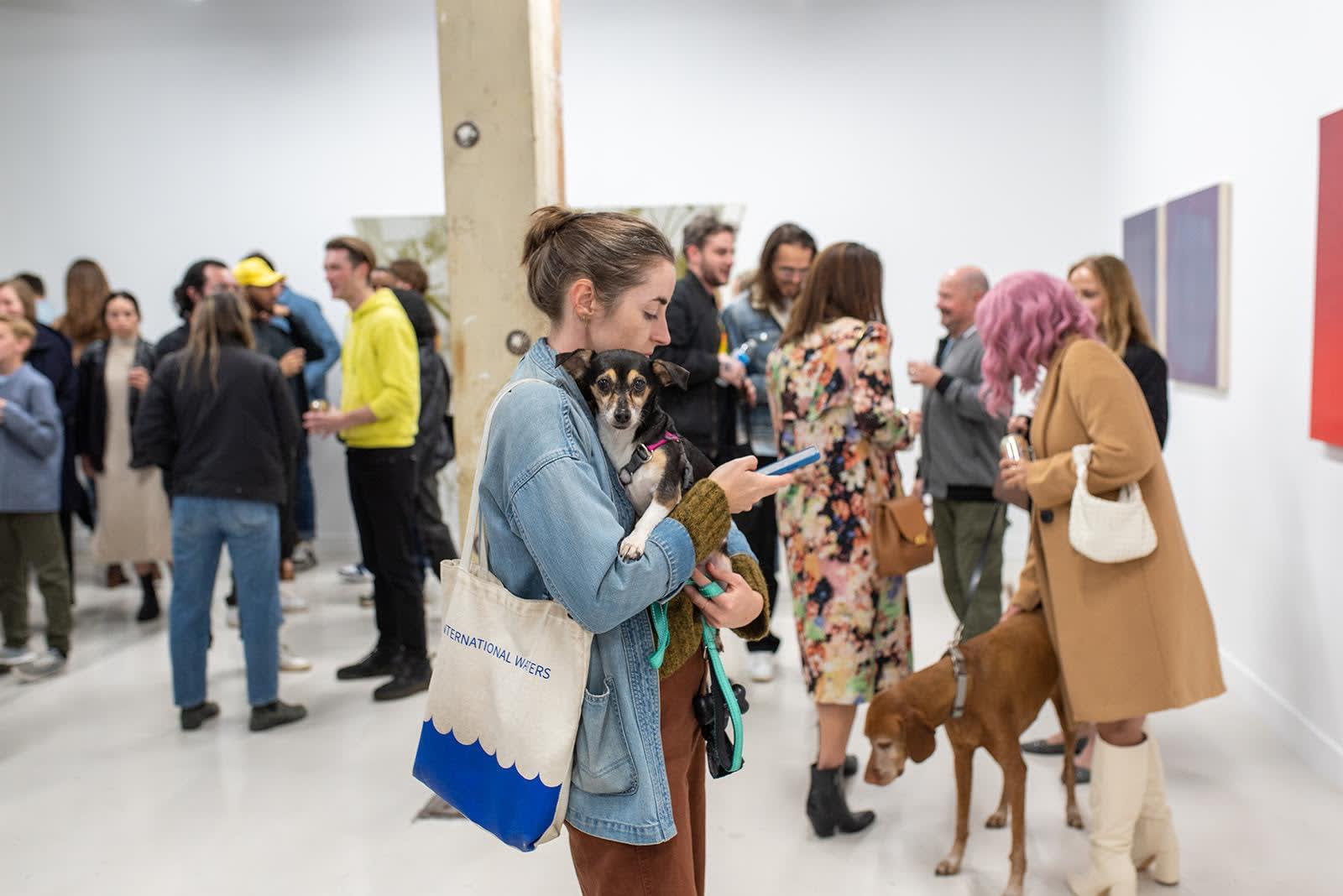 photo of a crowd of people in the art gallery