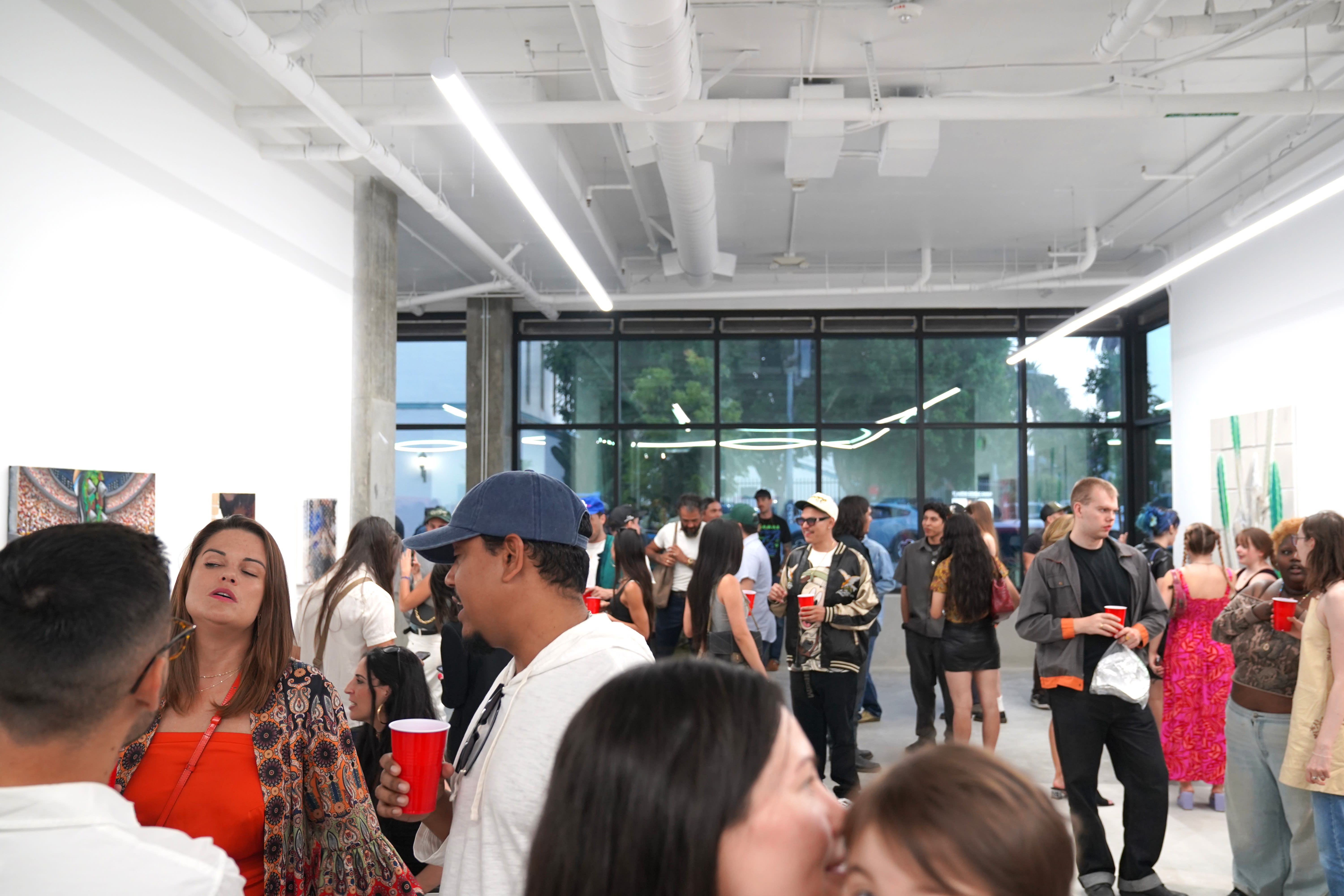 photo of a crowd of people in the art gallery