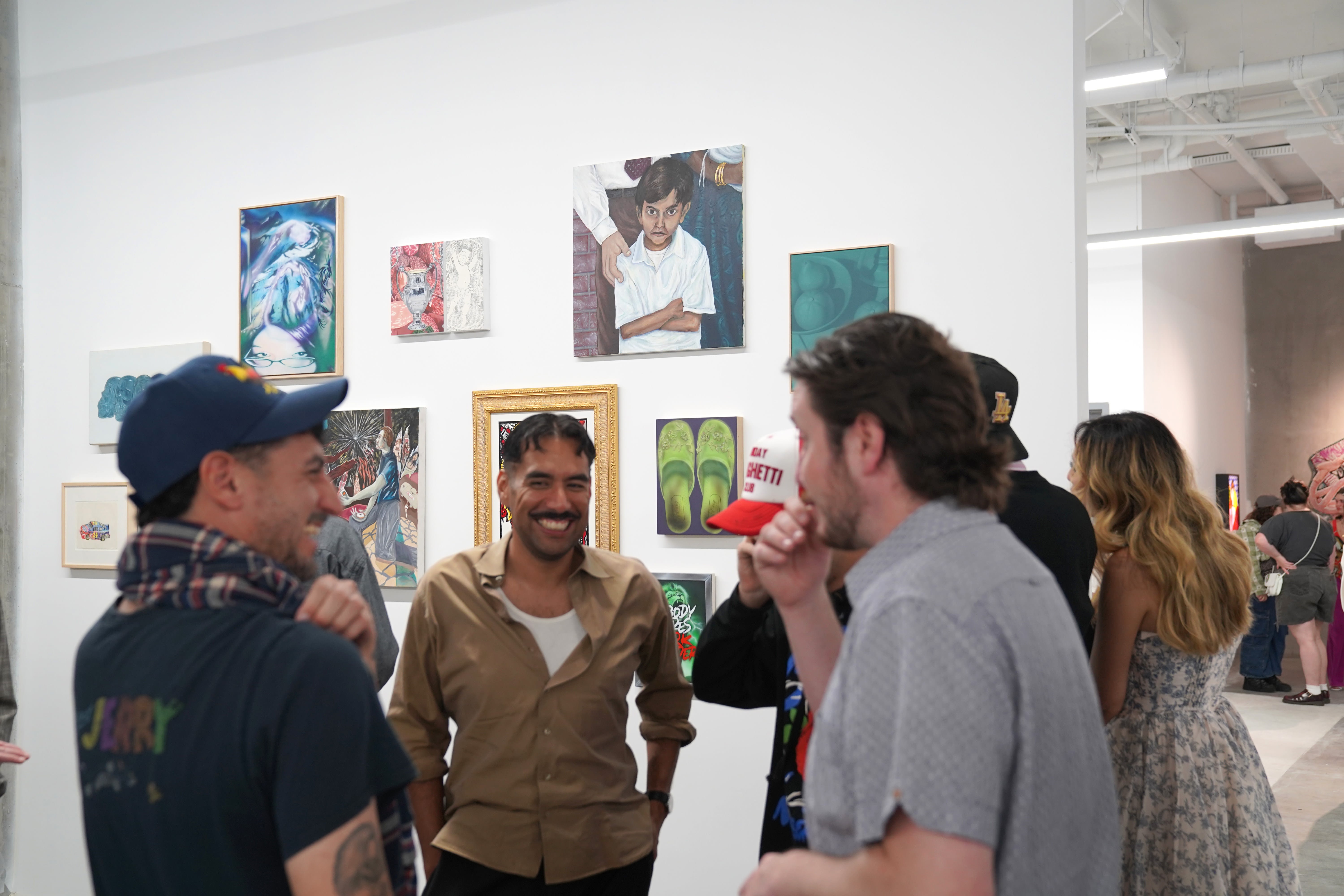 photo of a crowd of people in the art gallery