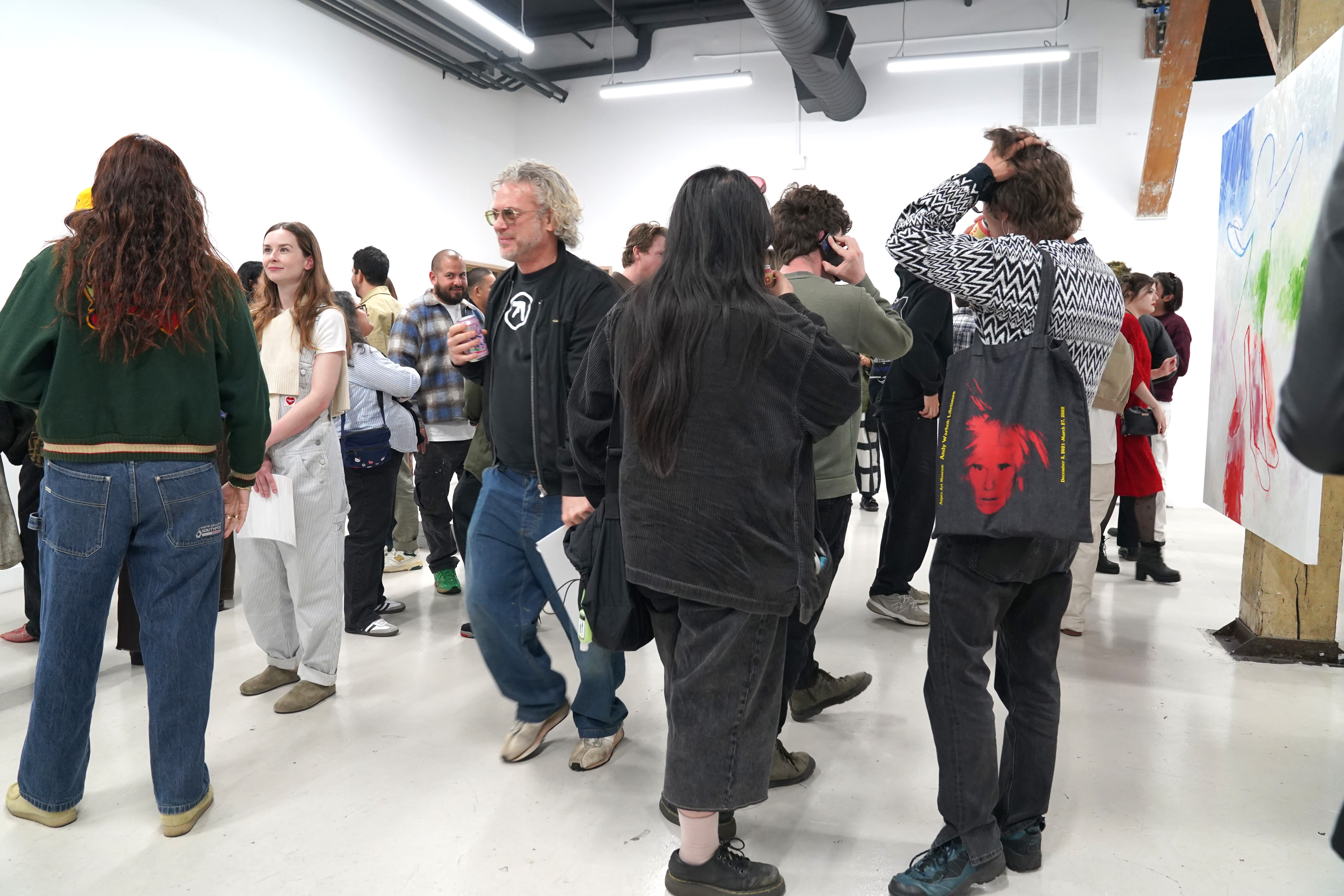 photo of a crowd of people in the art gallery