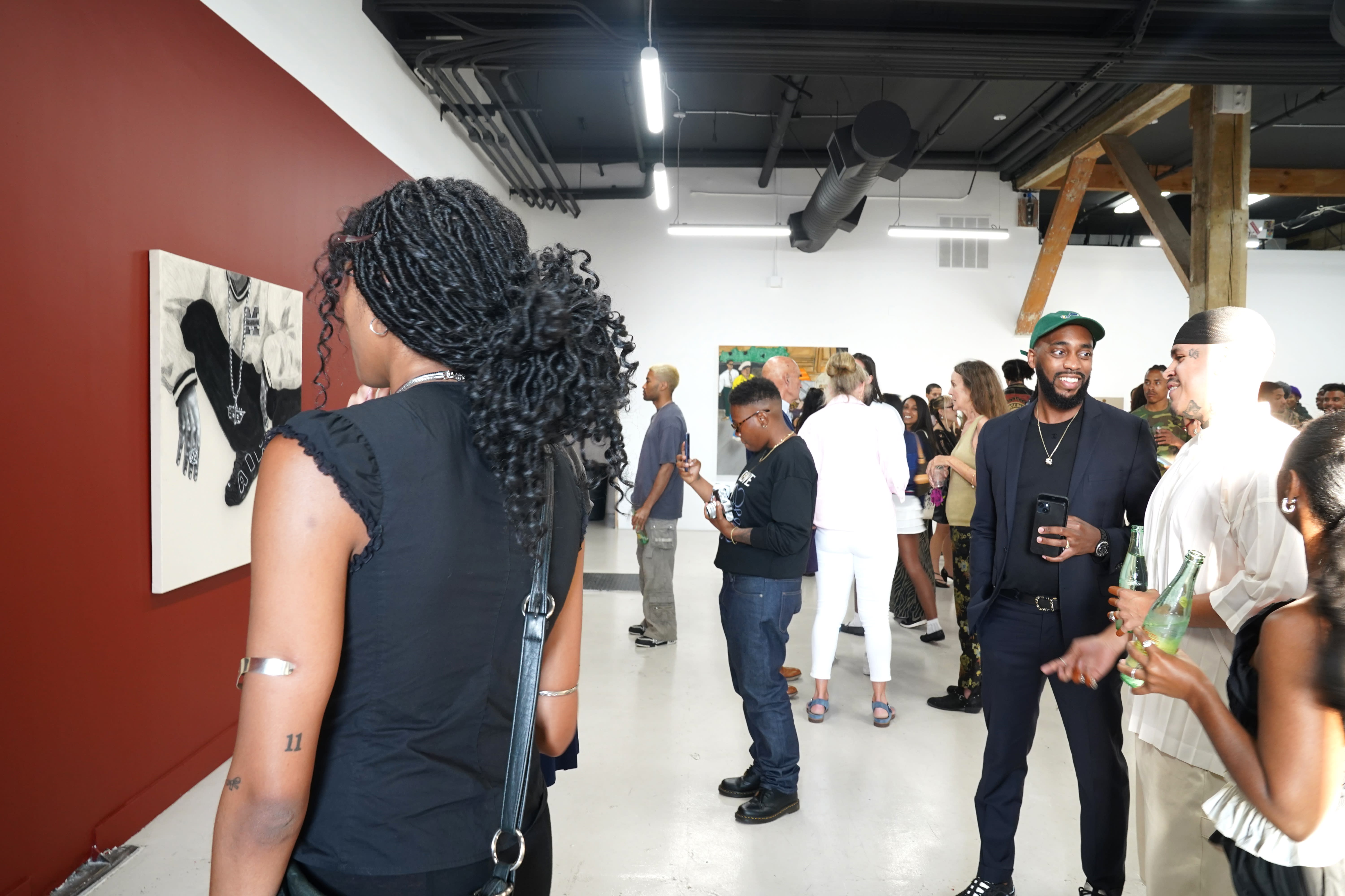 photo of a crowd of people in the art gallery