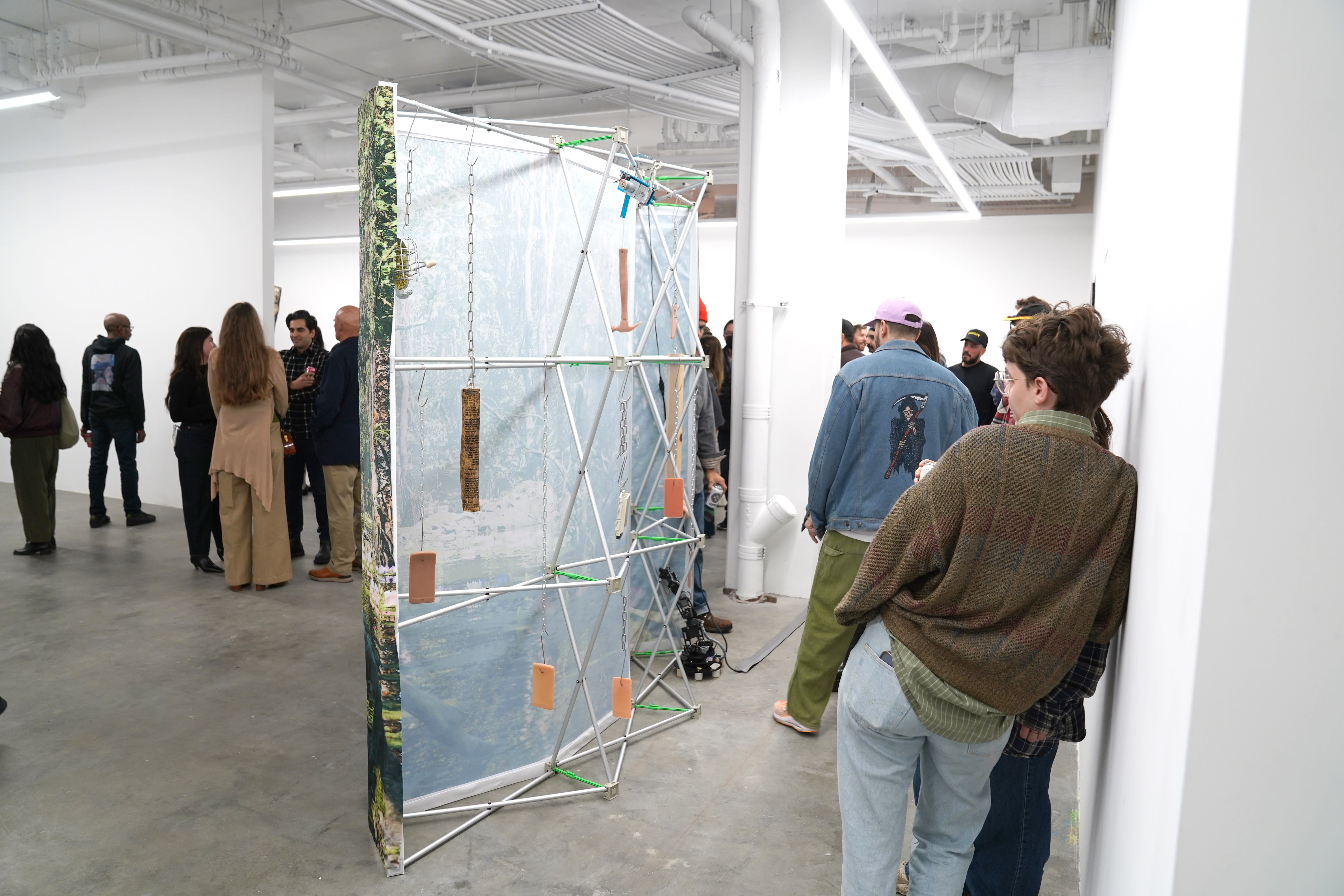 photo of a crowd of people in the art gallery