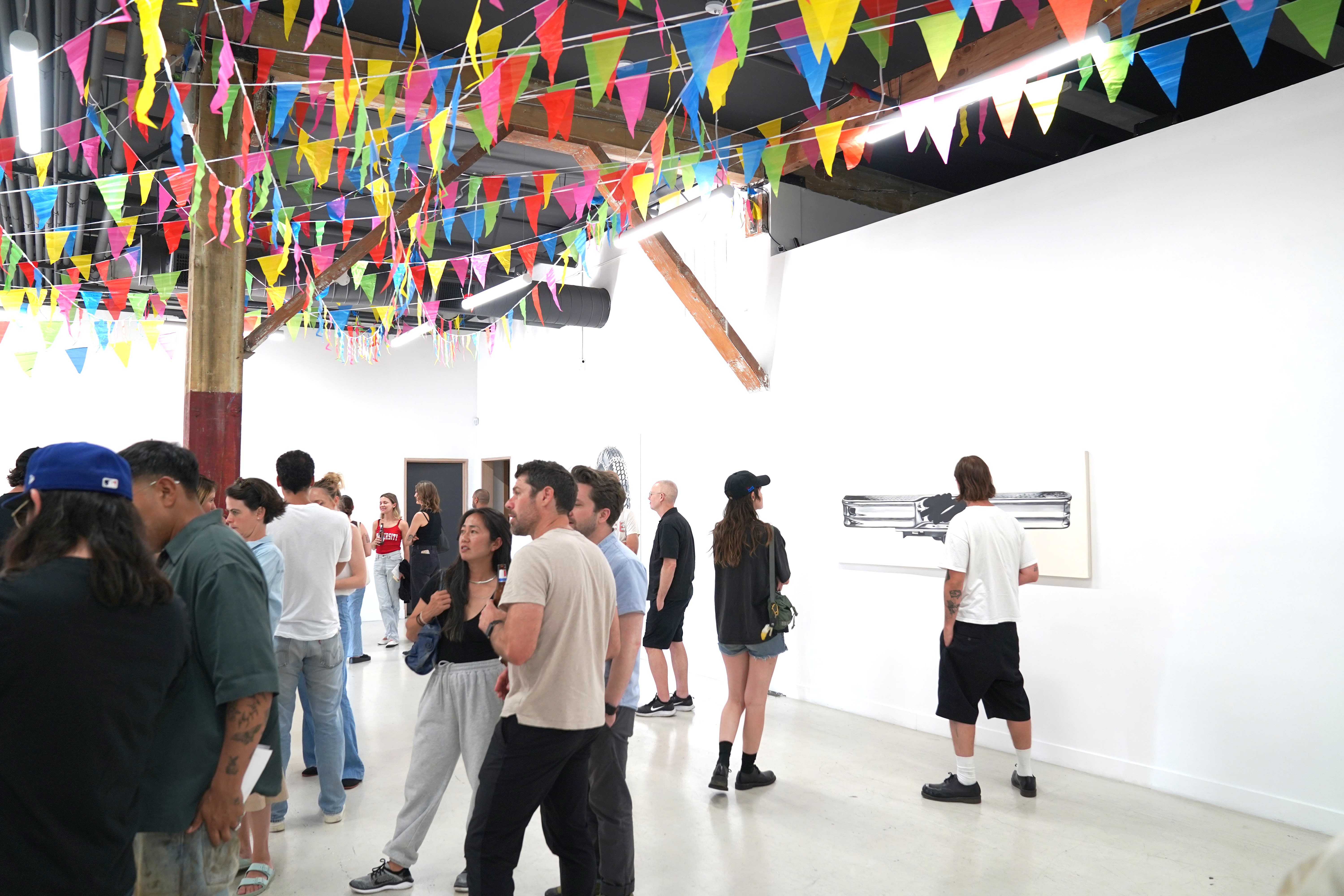 photo of a crowd of people in the art gallery