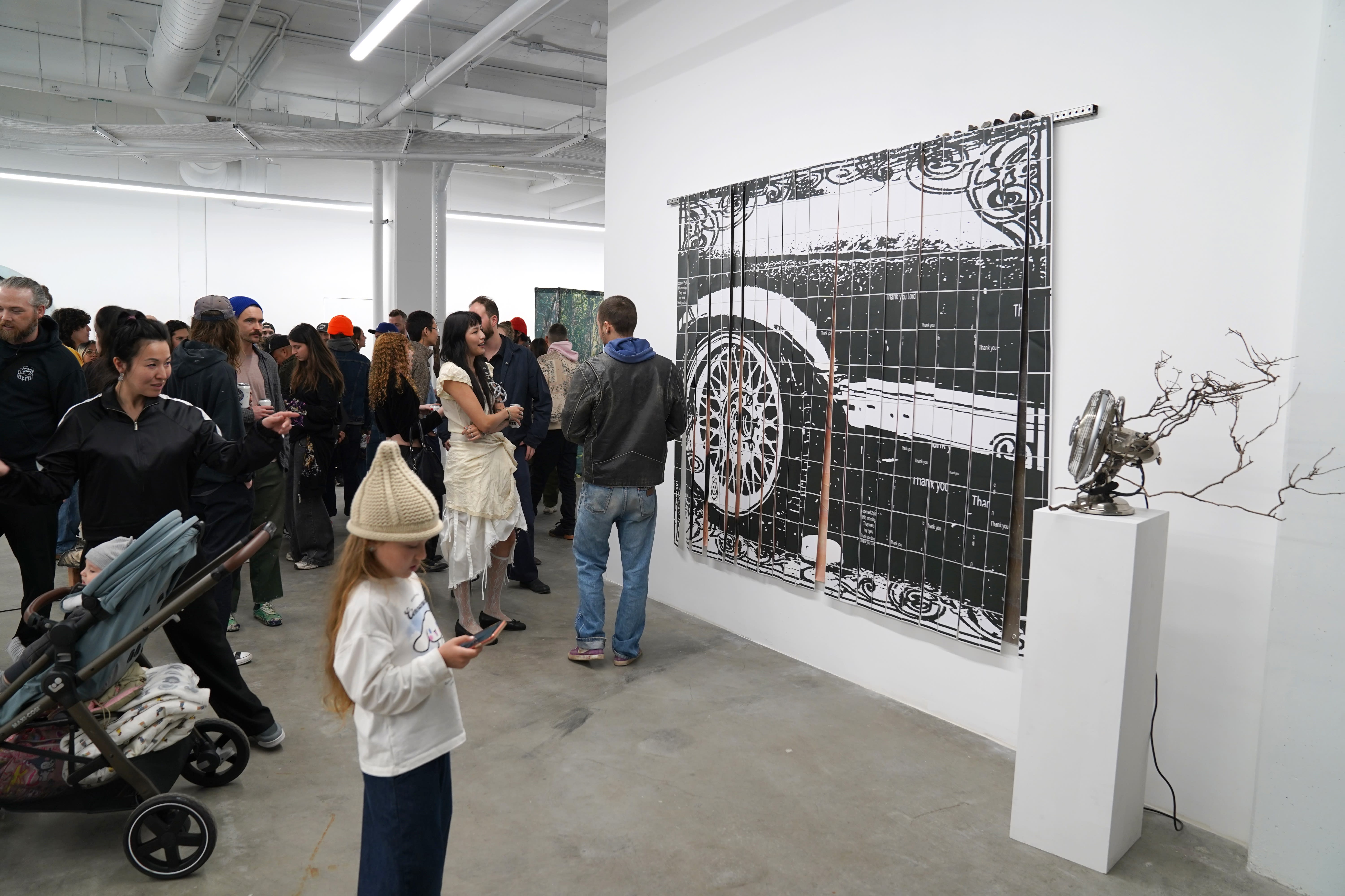 photo of a crowd of people in the art gallery