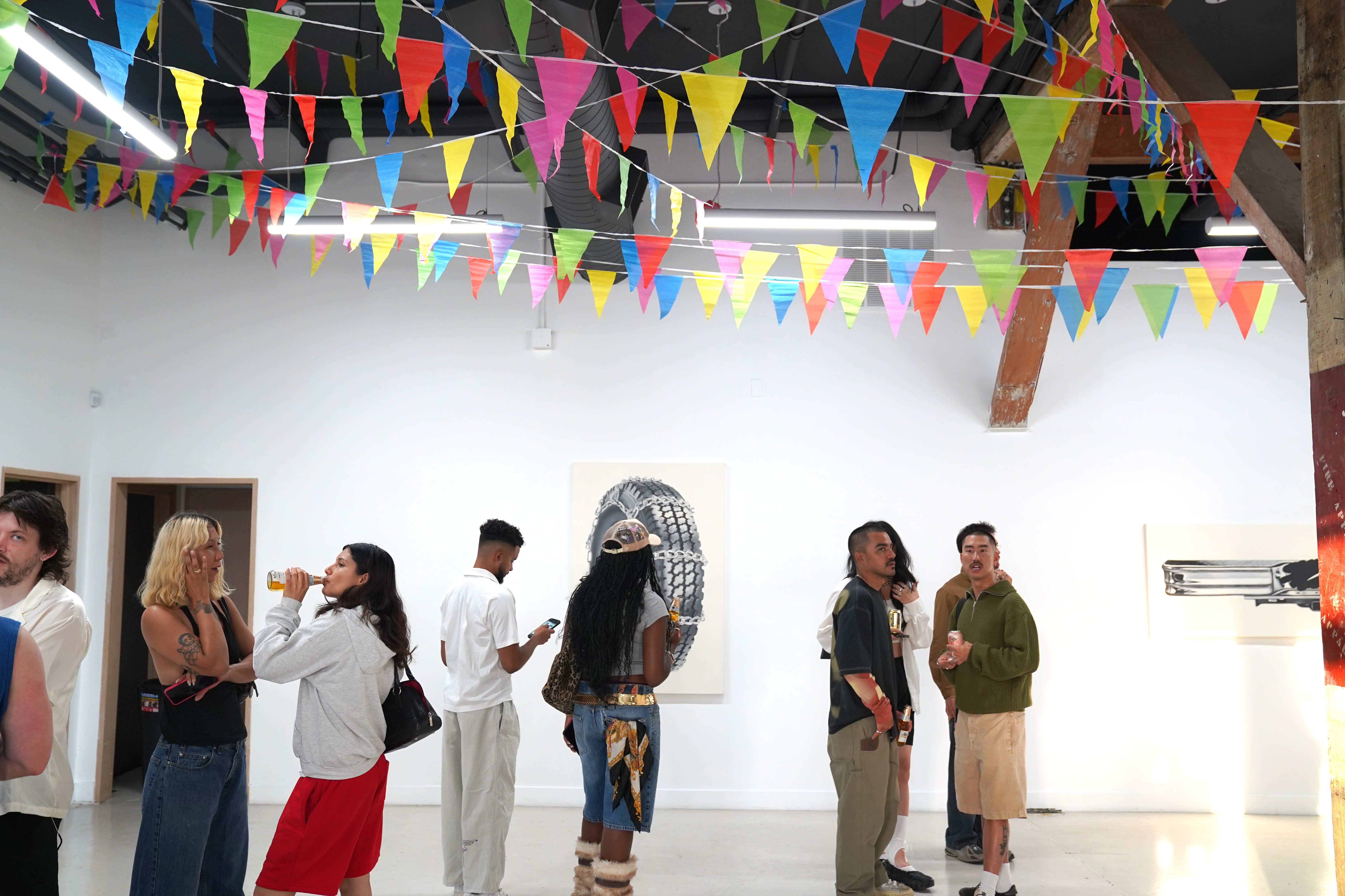 photo of a crowd of people in the art gallery