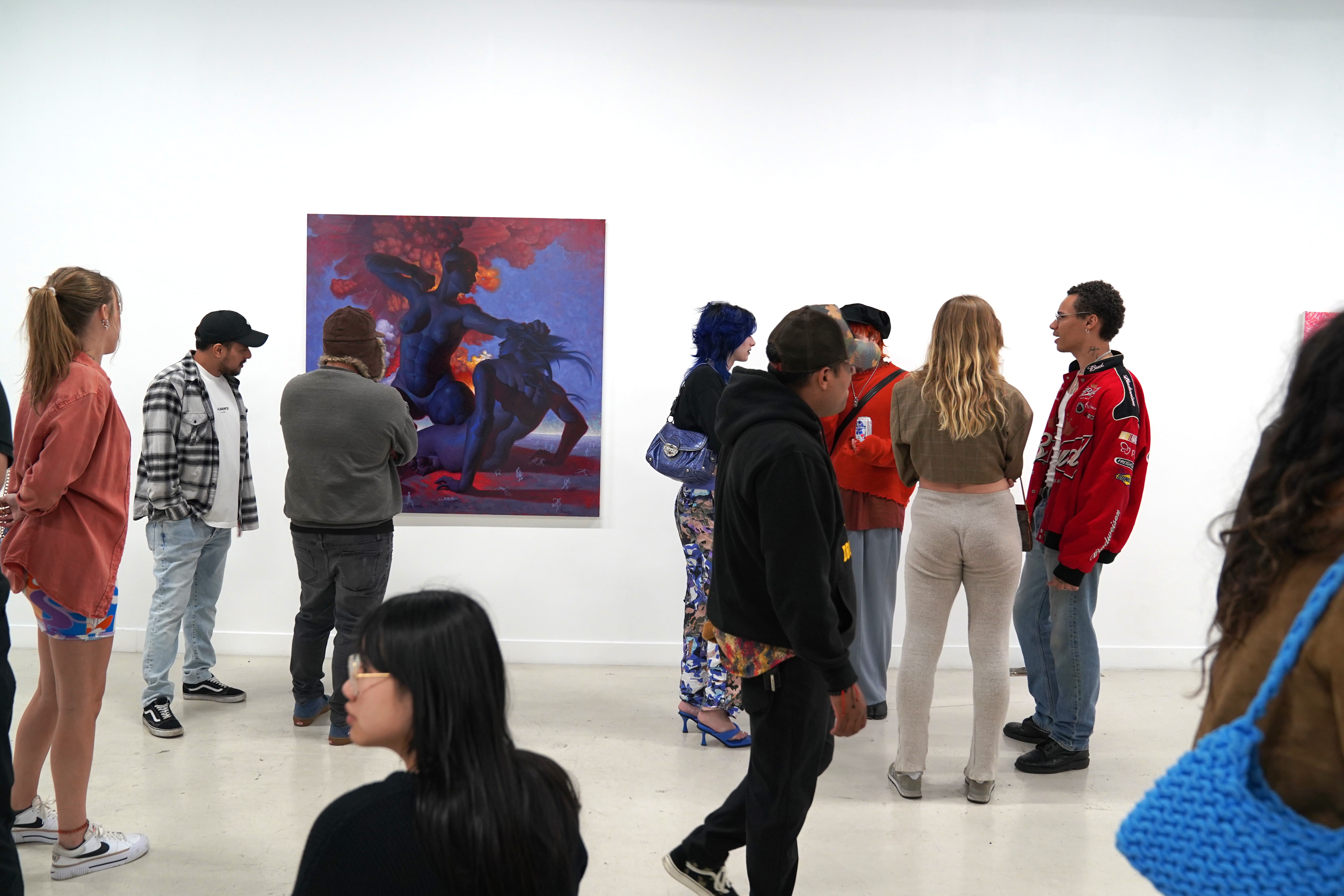photo of a crowd of people in the art gallery