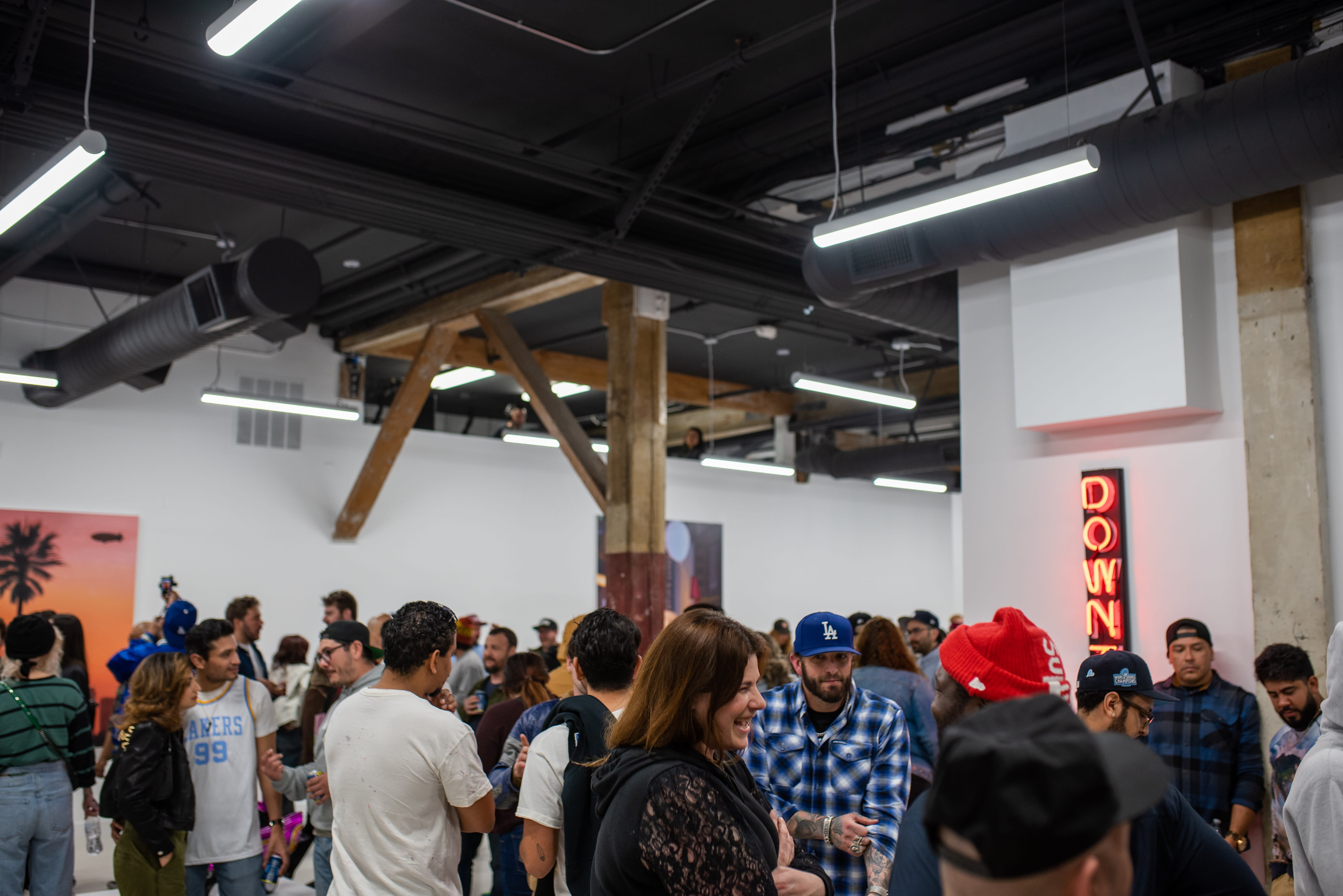 photo of a crowd of people in the art gallery