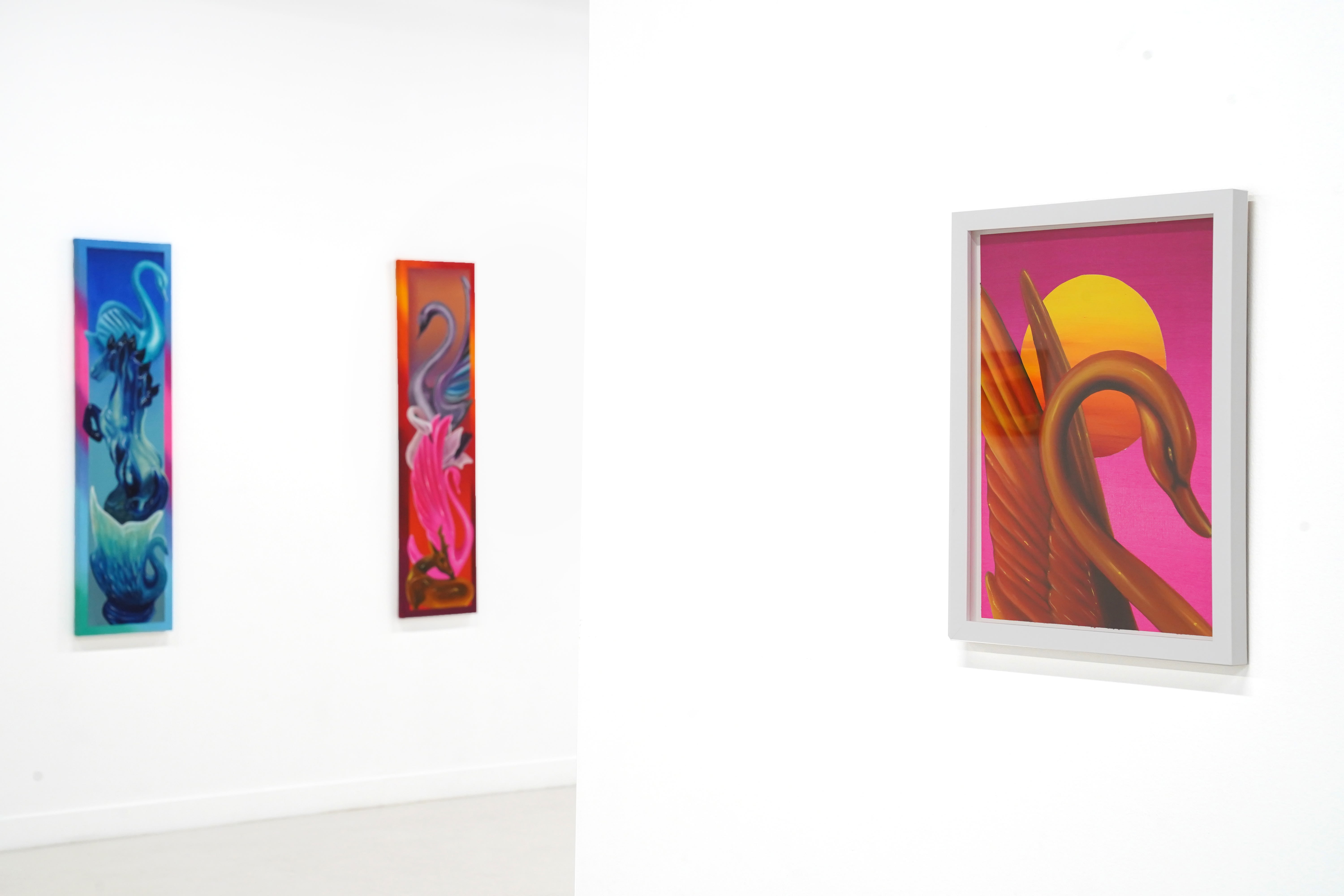 photo of 3 paintings by douglas de souza hanging on the wall