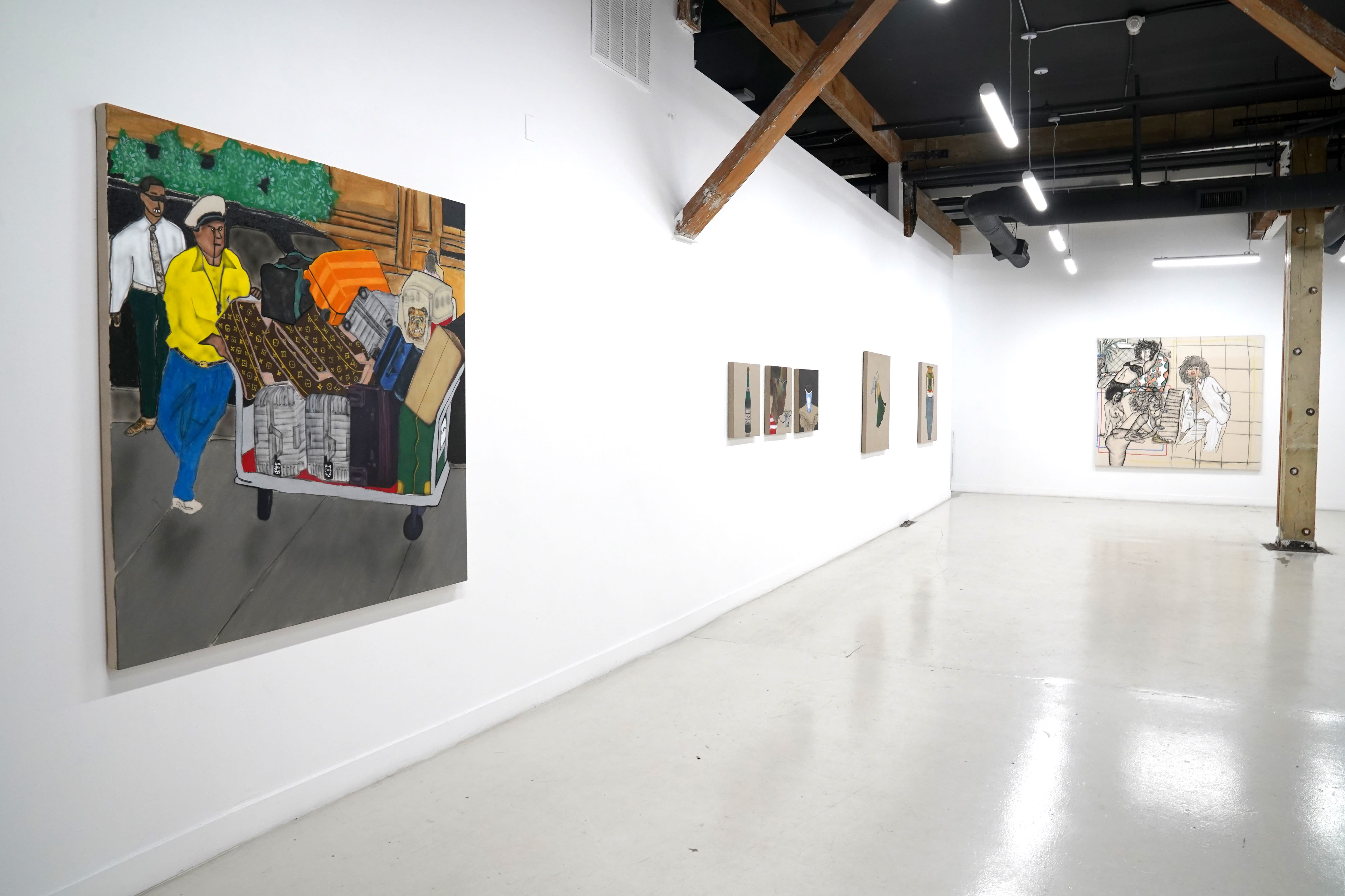 photo of the gallery with paintings hangiing on the wall