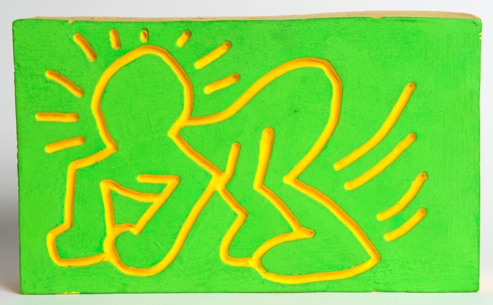 Unique wood carving with vivid green and yellow dayglo paint. Signed by Haring. 18 x 30.5 x 6cm