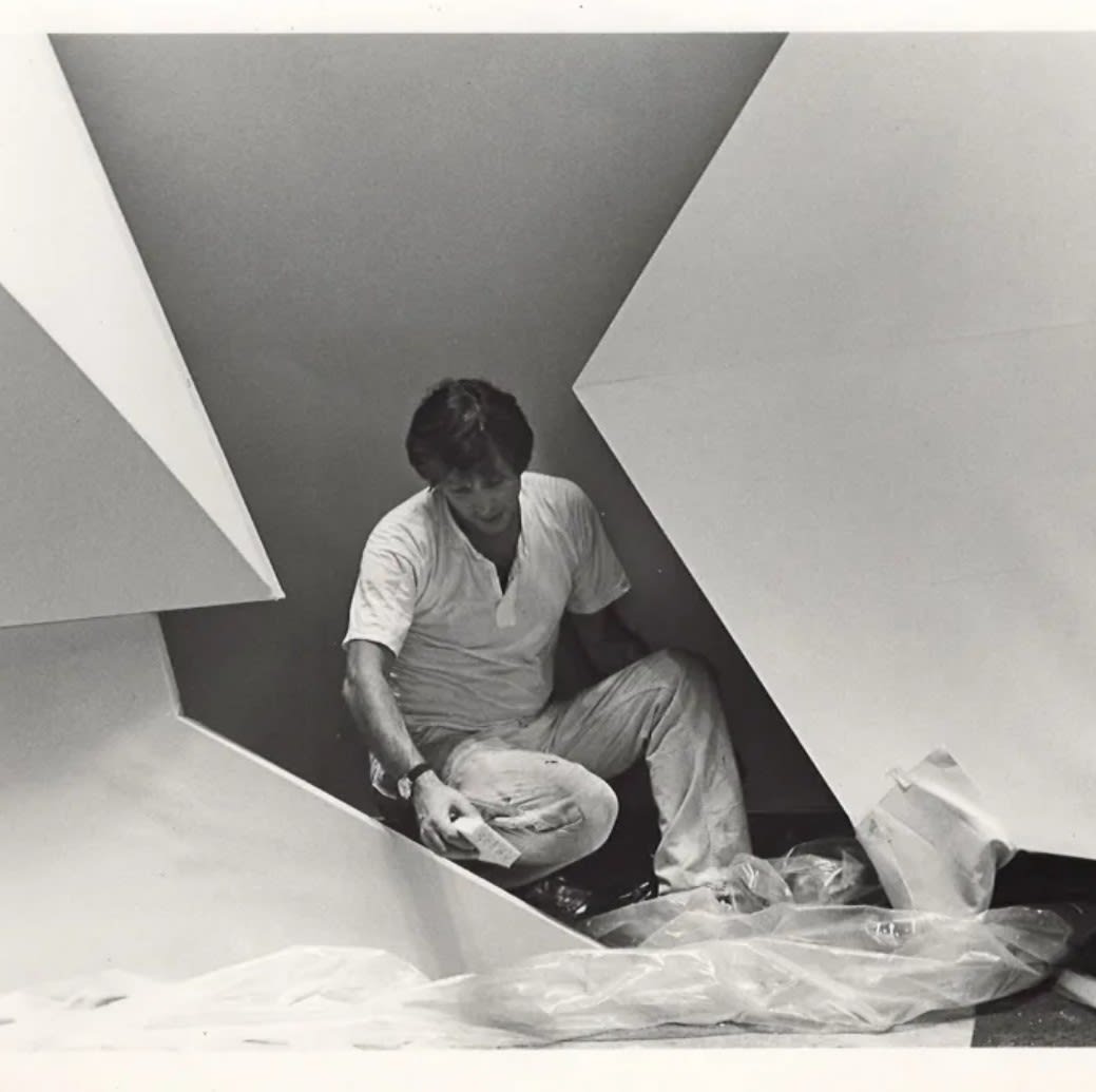 Artist Charles Hinman working on a painting in 1980