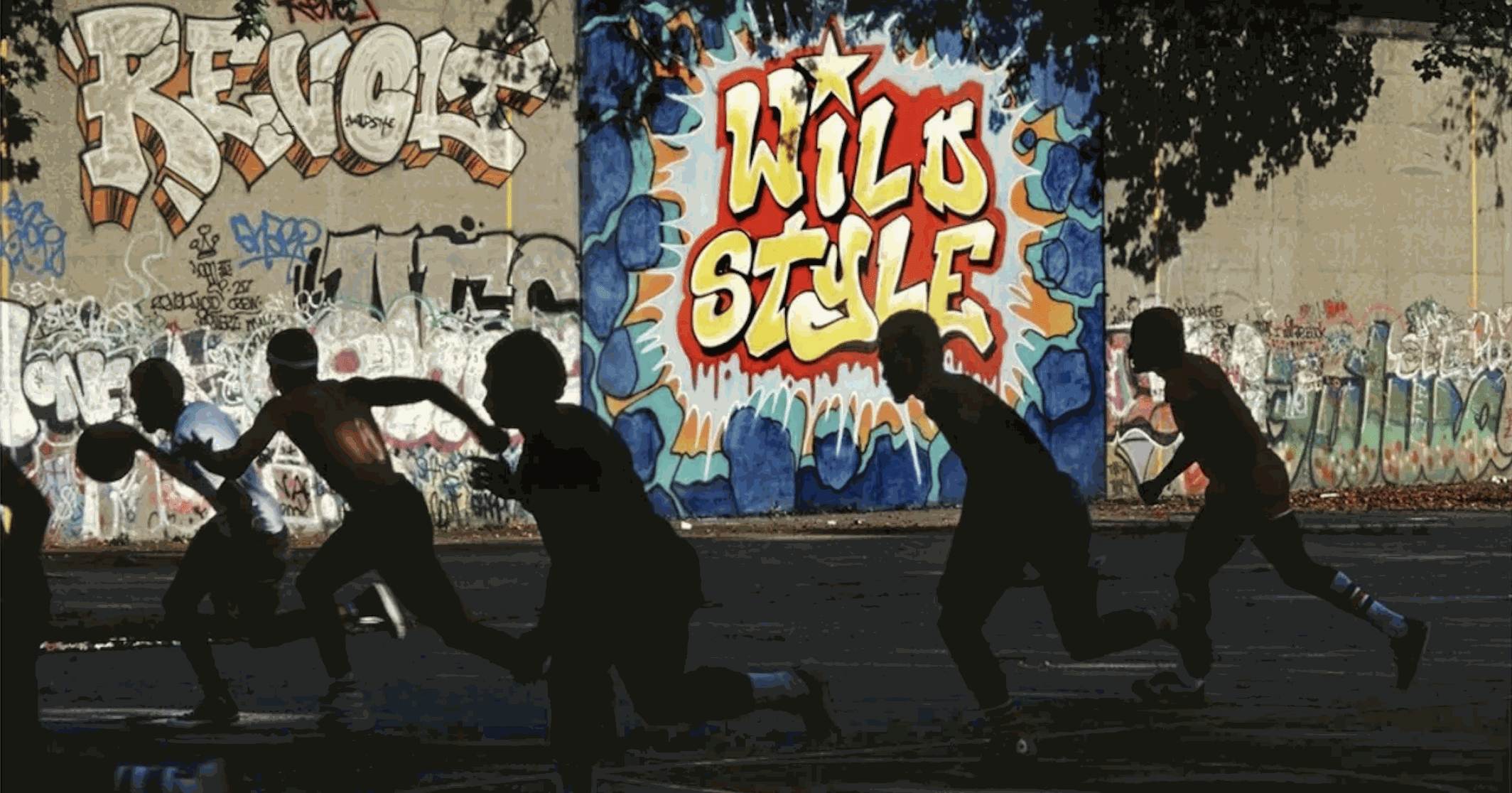 New York youth running on basketball court during the 1970s.