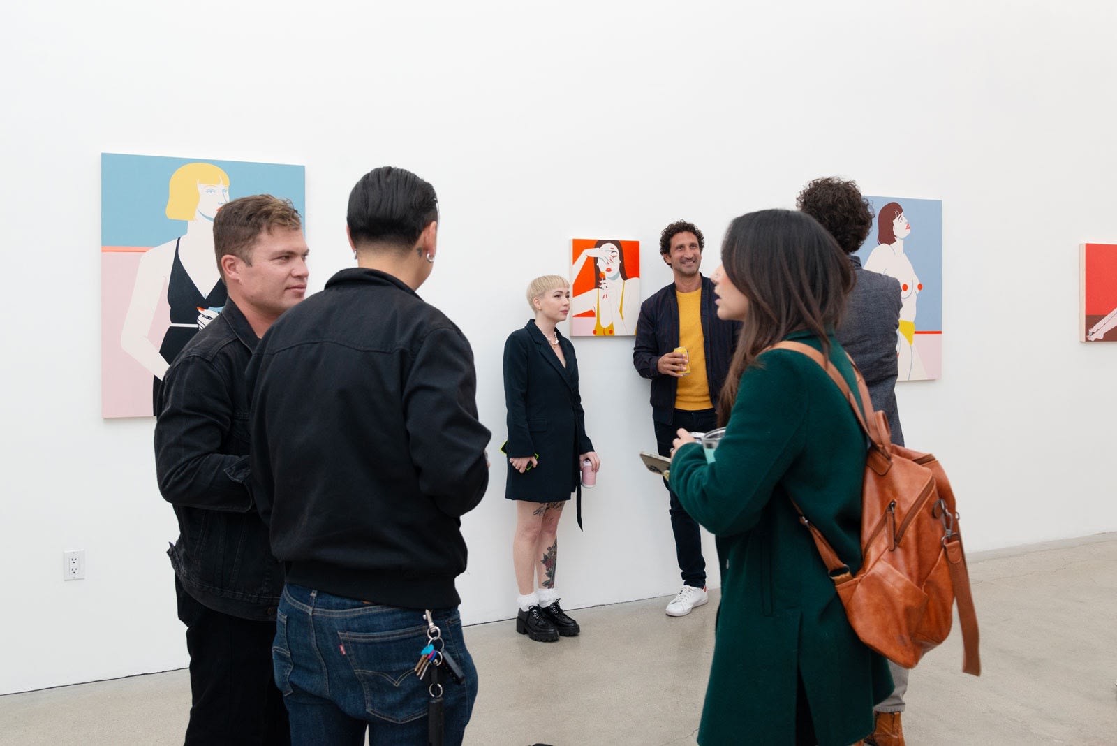 Photo of people in the gallery on opening night with Jillian Evelyn 