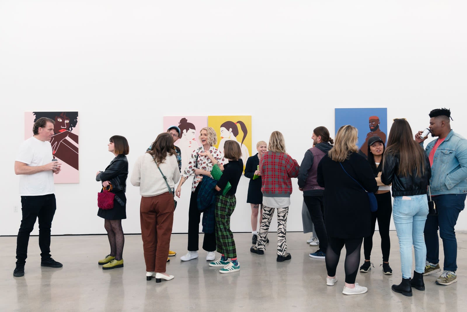 Photo of friends, collectors and Jillian Evelyn in the gallery on opening night