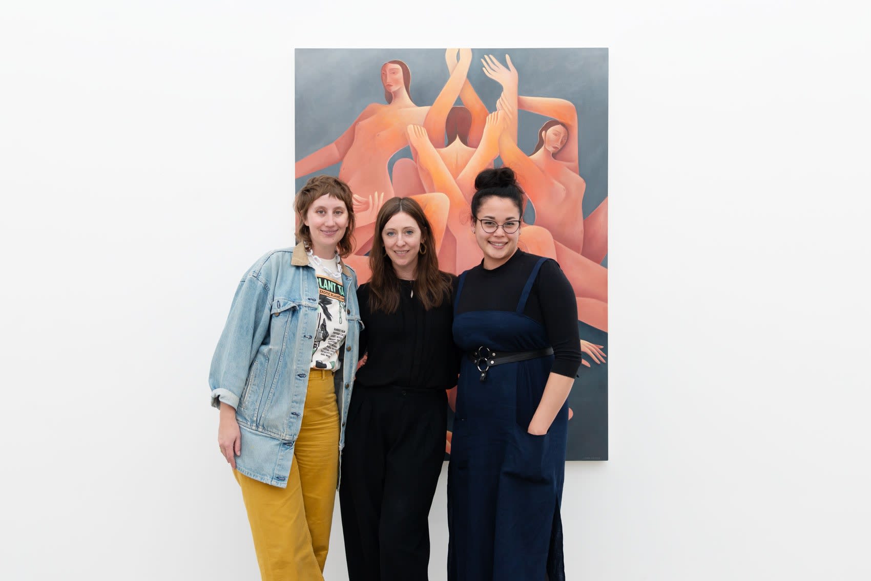 Image of artists Madeline Tonzi and Laura Berger with director Dasha Matsuura in front of Laura Berger's painting 