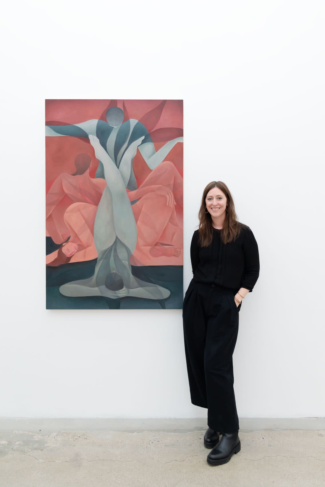 Artist Laura Berger in front of her painting 