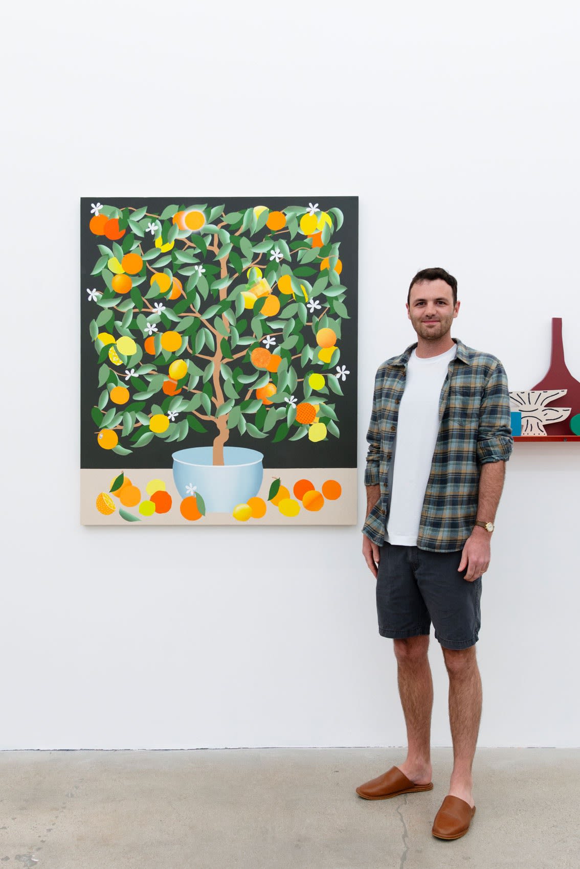Artist Stephen D'Onofrio next to his painting at the opening reception of Pith at Hashimoto Contemporary Los Angeles.