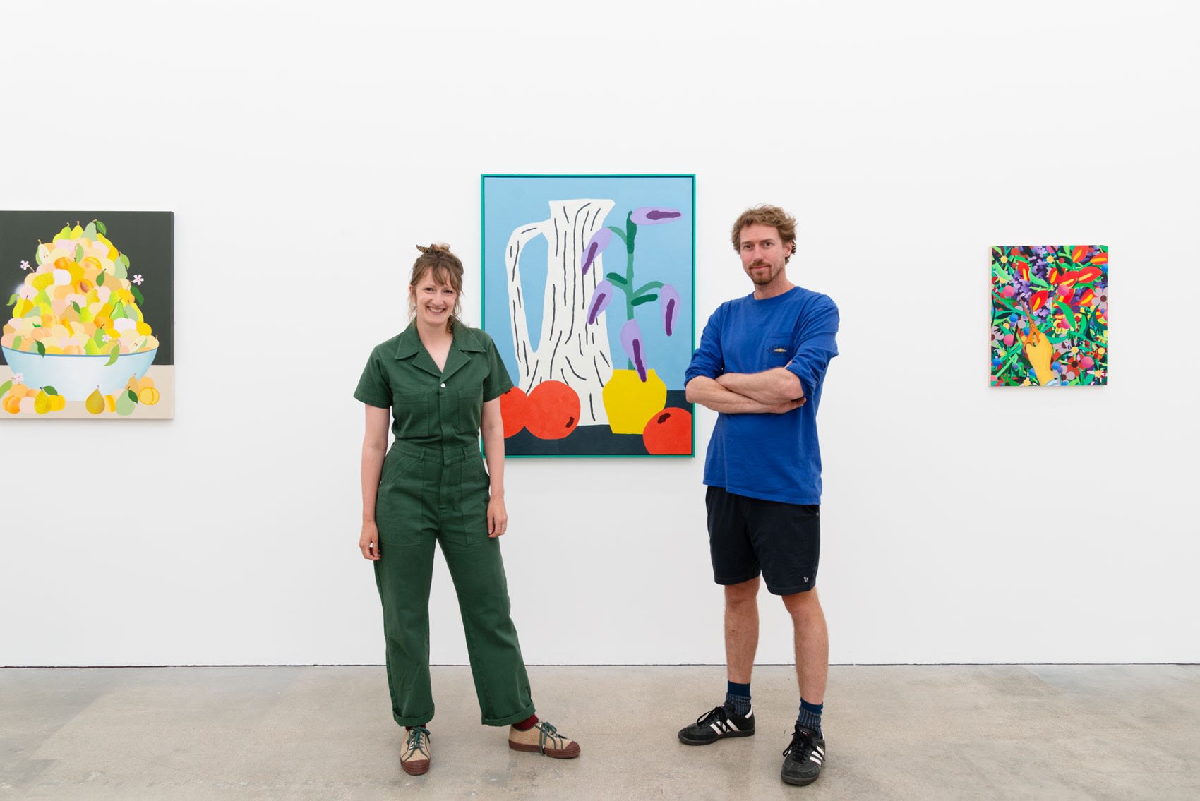 Artists duo We Are Out Of Office in front of their painting at the opening reception of Pith at Hashimoto Contemporary LA
