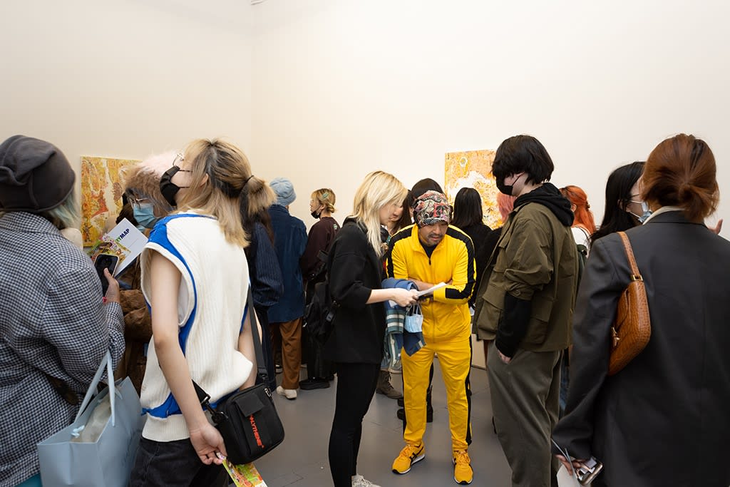 Artist Mu Pan talking with guests at the opening reception