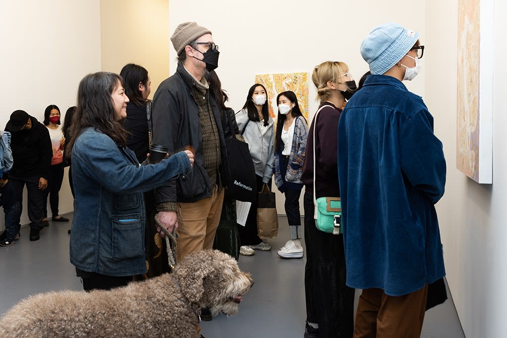 crowd of people at Mu Pan exhibition opening reception