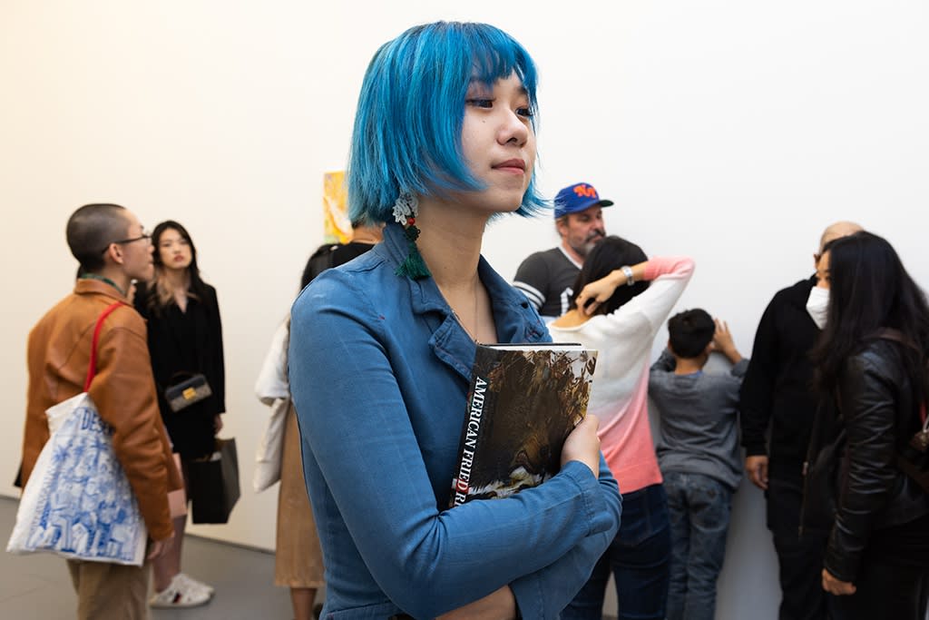 woman with blue hair at opening reception of Mu Pan show