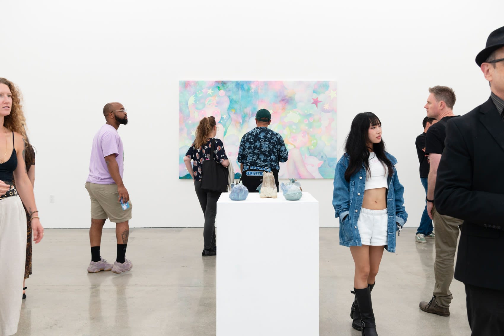 Visitors mingle at the So Youn Lee opening Anomaly