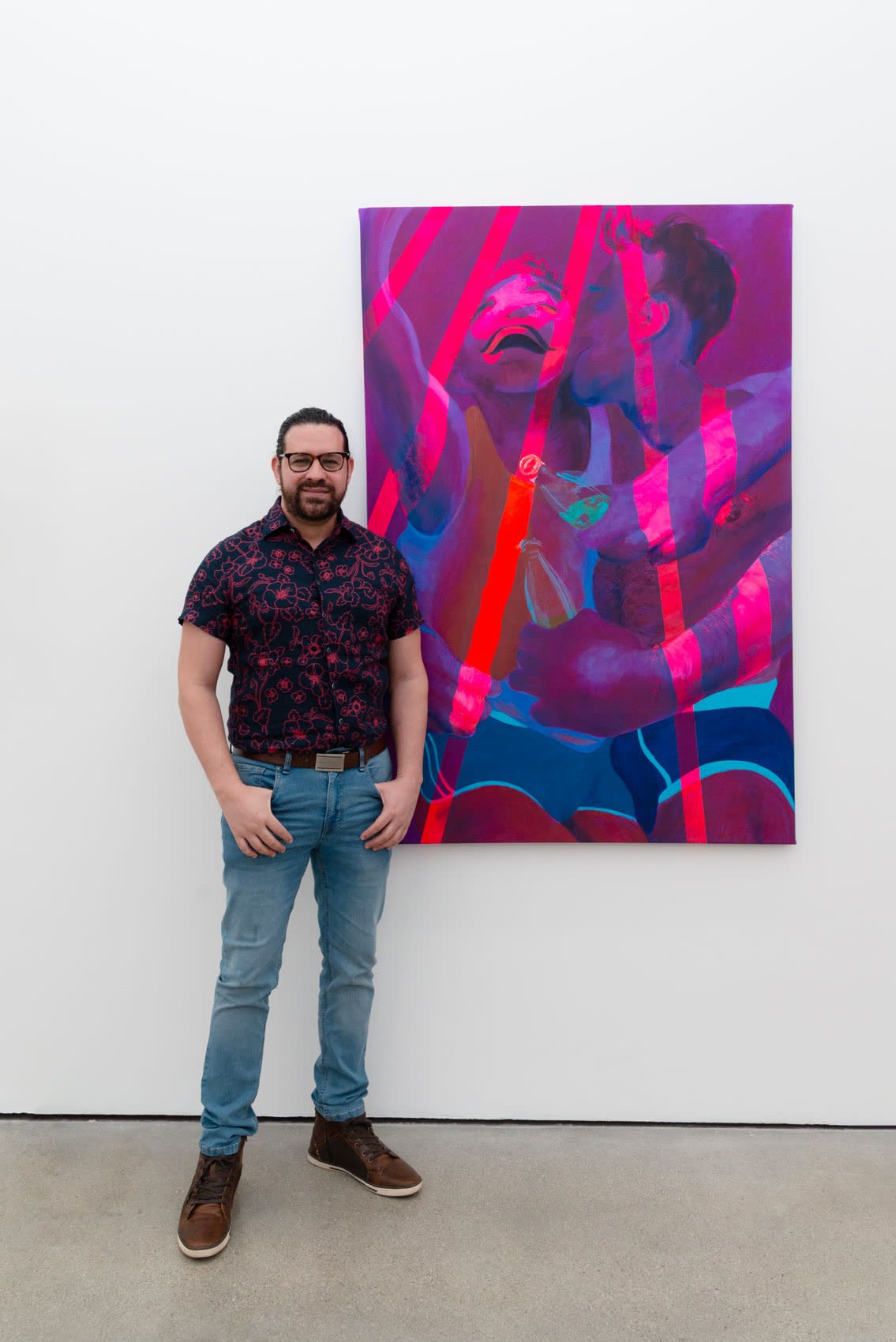artist Jean Paul Mallozzi poses in front of his artowork