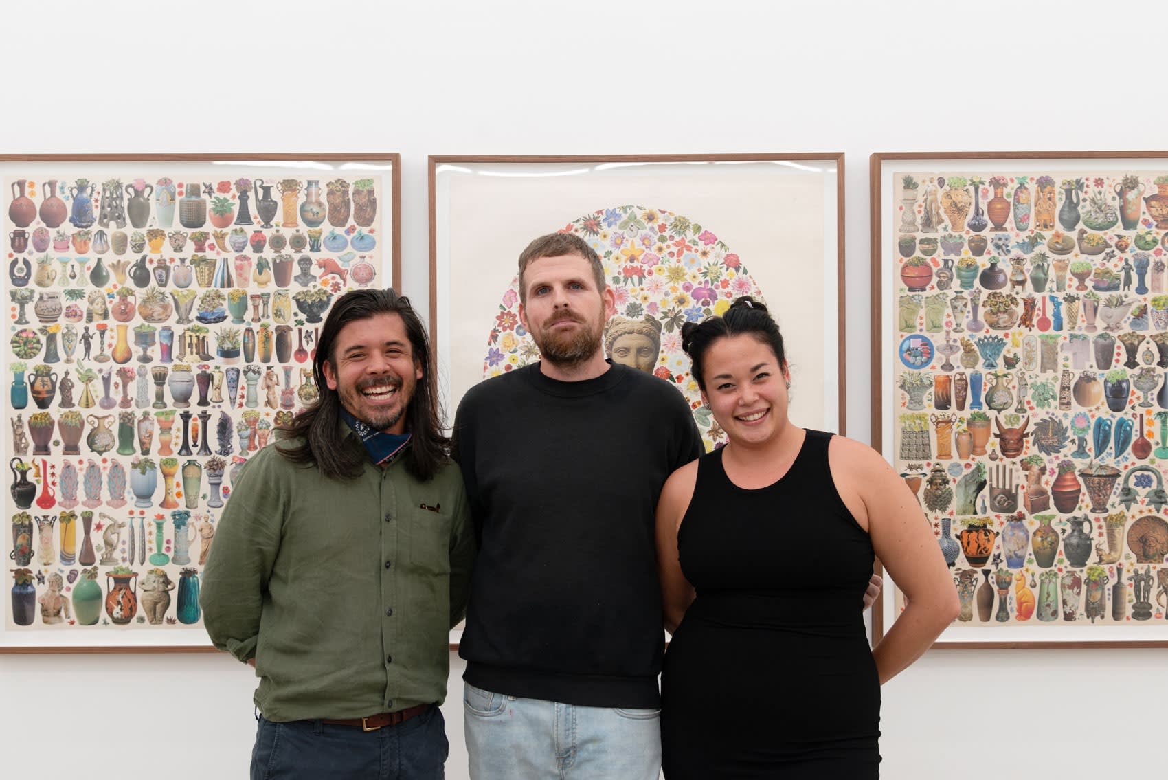 Gallery owner Ken Harman Hashimoto with LA Director Dasha Matsuura and artist Matthew Craven in front of a series of three large collage works. 