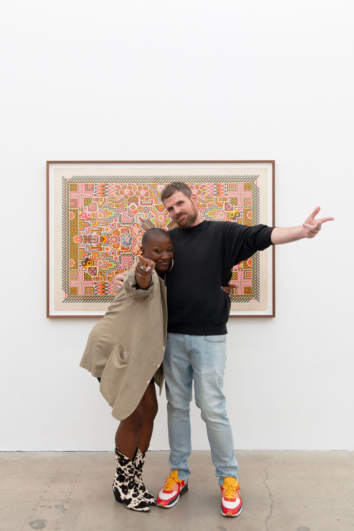 Artist Matthew Craven and florist Tosha Stimage in front of Matthew's drawing DREAM/WEAVR, 2023