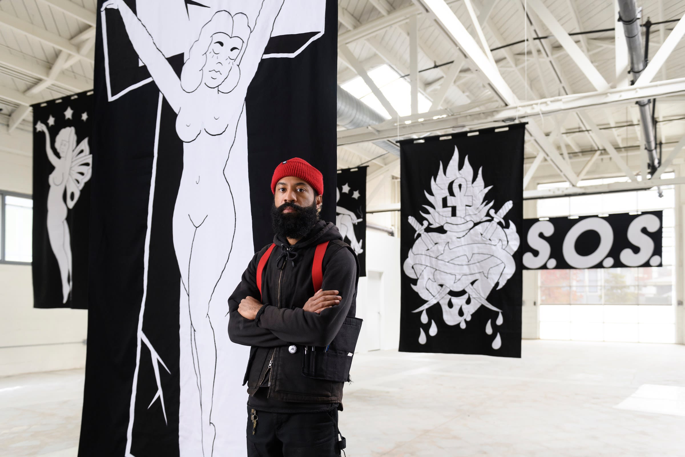 artist chris martin in front of his artwork at the ICA San Francisco