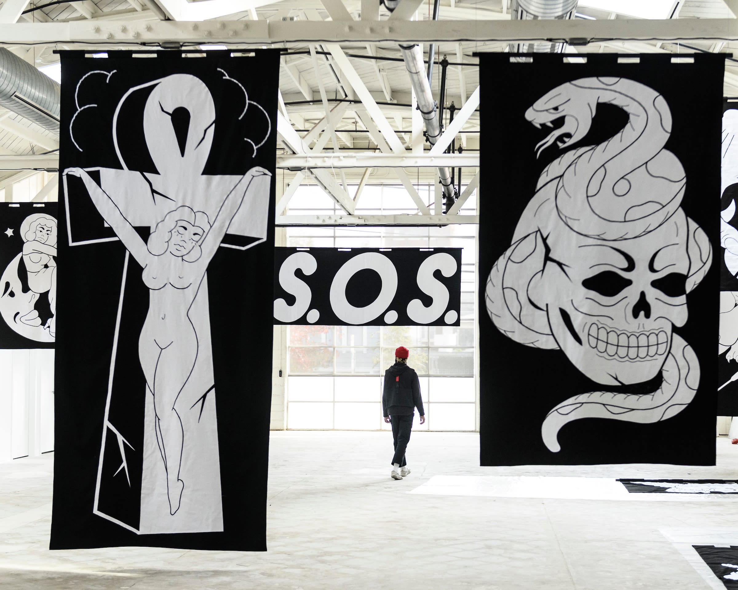 artist chris martin in front of his artwork at the ICA San Francisco