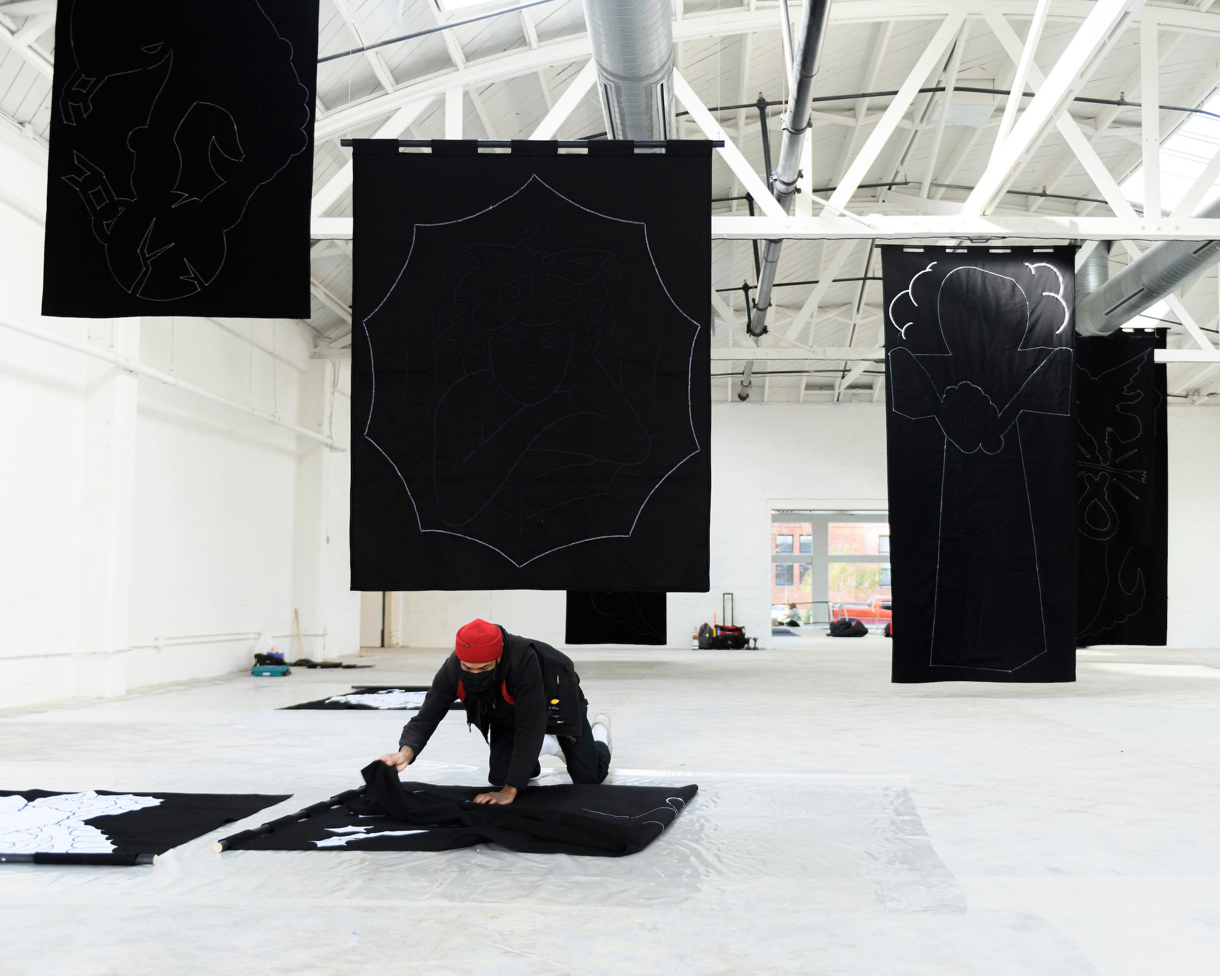 artist chris martin in front of his artwork at the ICA San Francisco