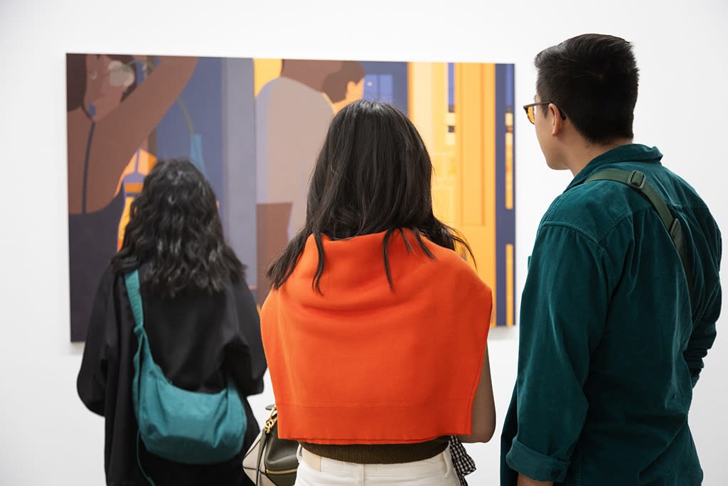 Photo of visitors viewing the latest paintings by artist Adrian Kay Wong at the opening reception of his solo exhibition
