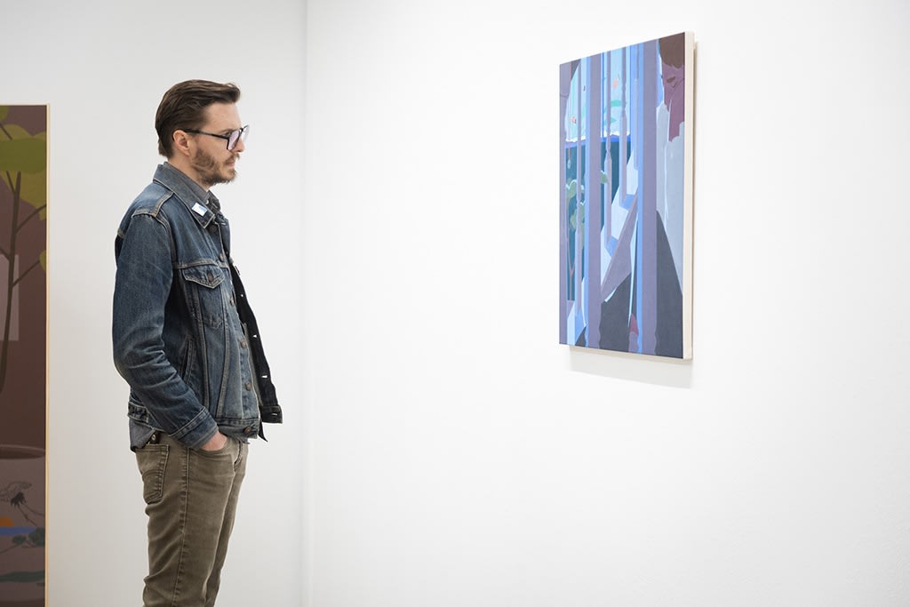 Image of a person looking intently at a painting by artist Adrian Kay Wong at his opening at Hashimoto Contemporary, San Francisco