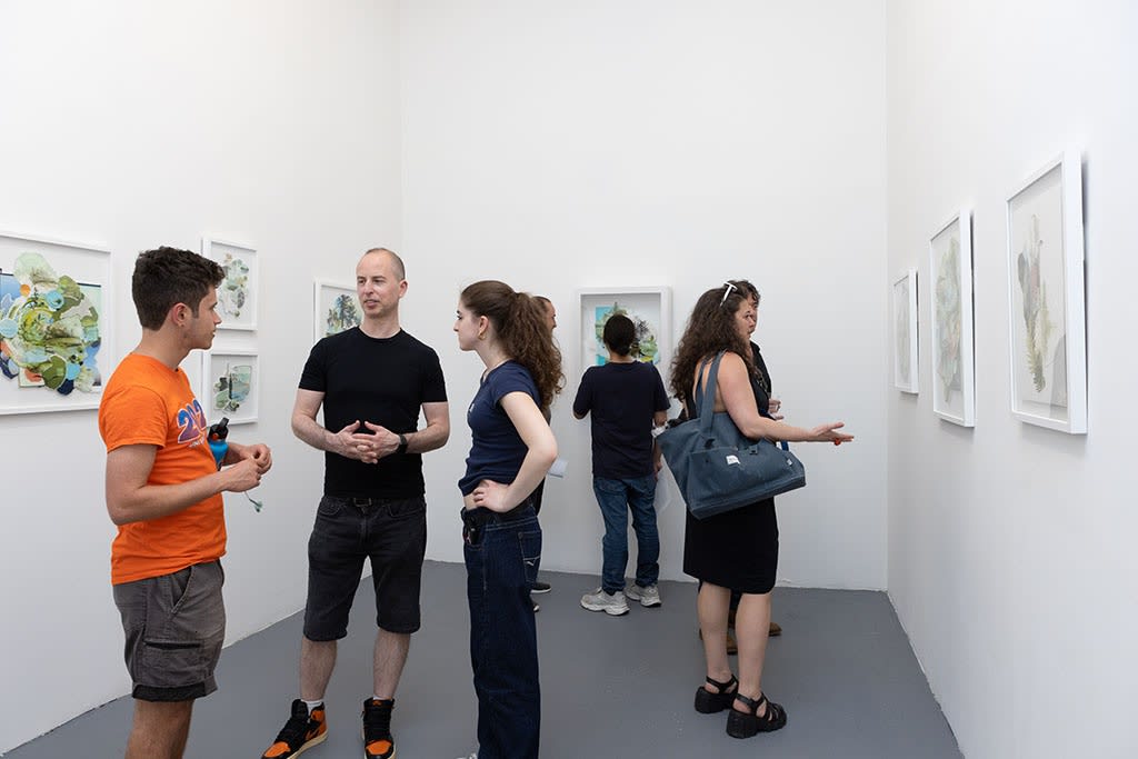 people talking at the opening of Gregory Euclide's Assembled Lands