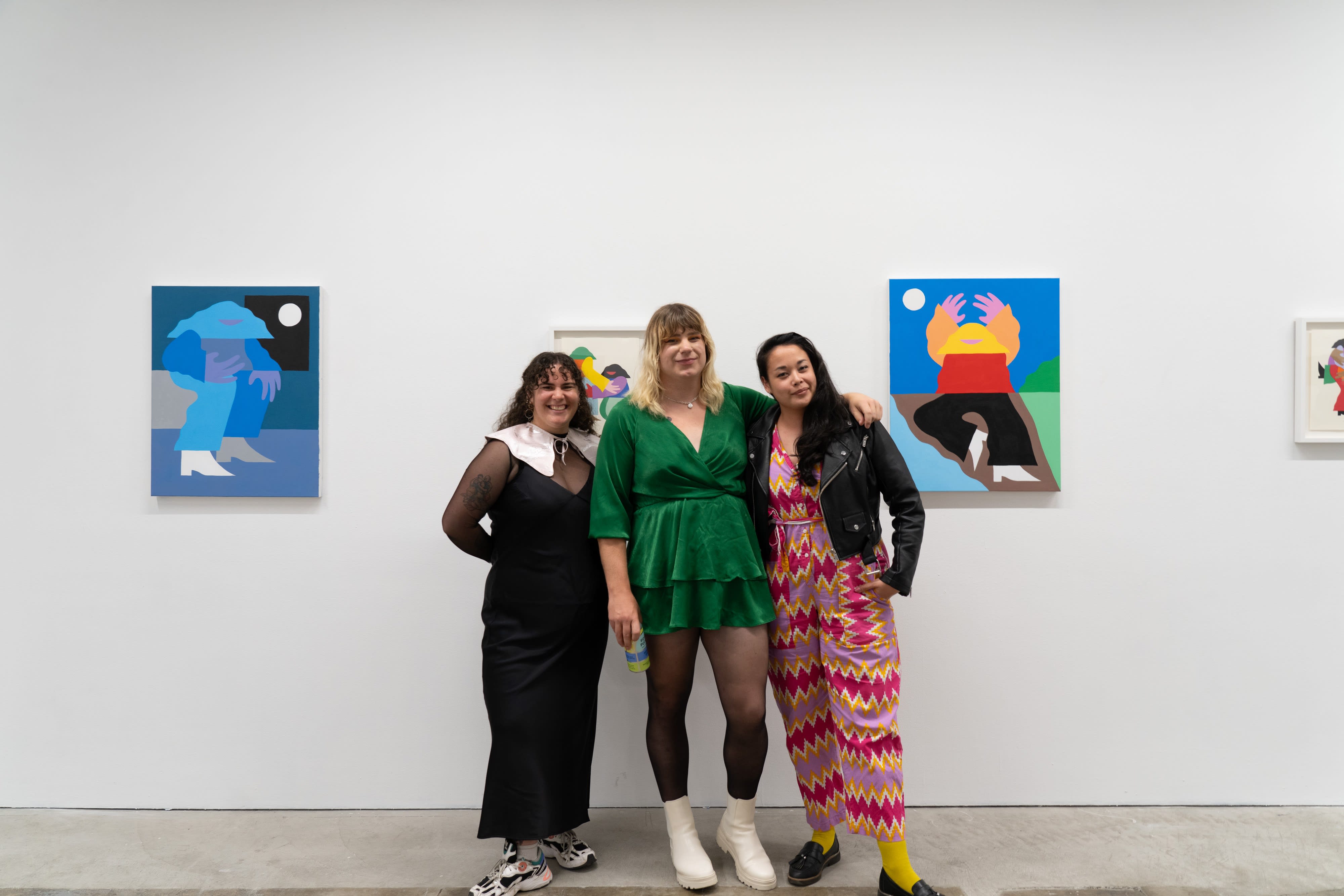 Communications Associate Katherine Hamilton, artist Marbie, and LA Director Dasha Matsuura pose together in front of Marbie's work. 