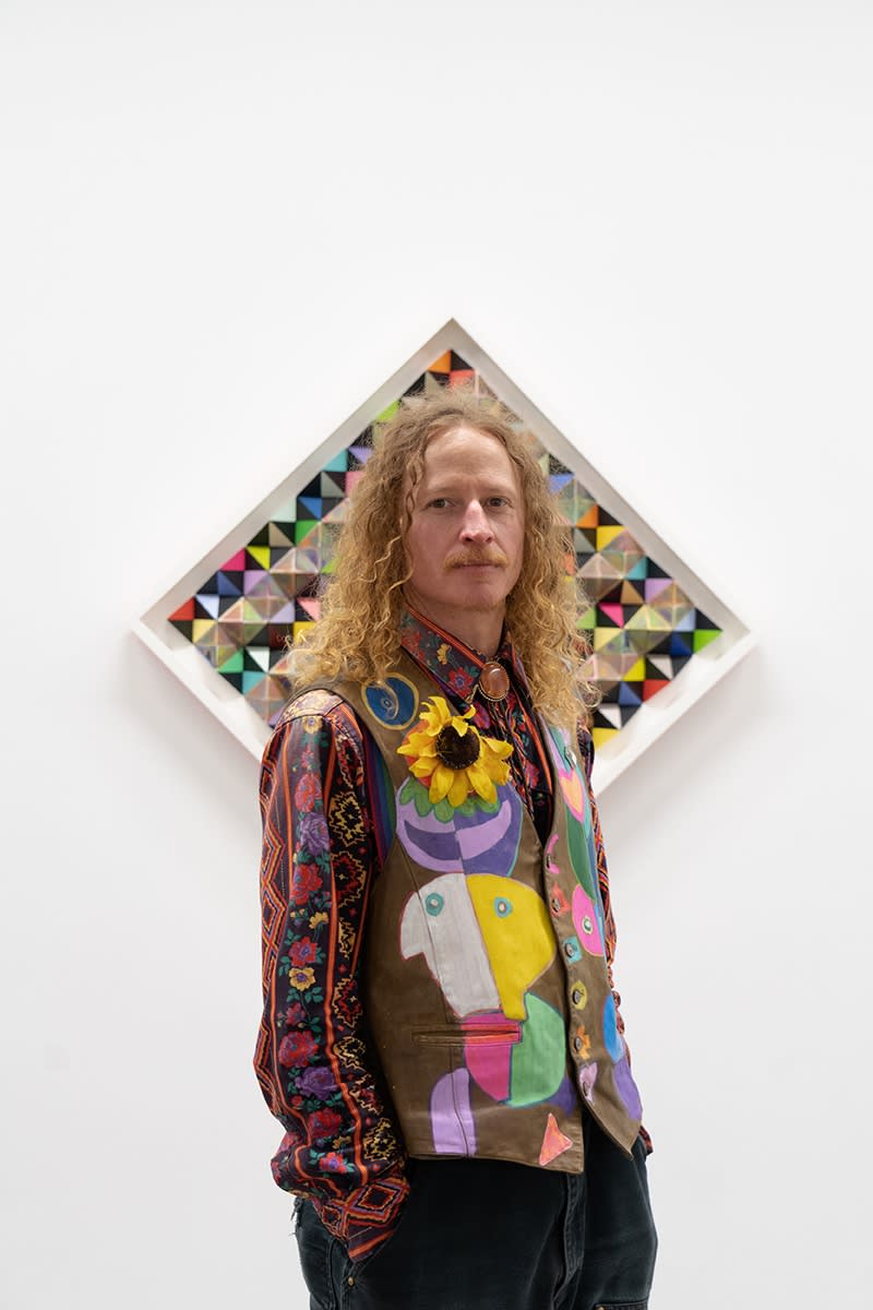 Portrait of artist Sean Newport in front of his work at Hashimoto Contemporary San Francisco