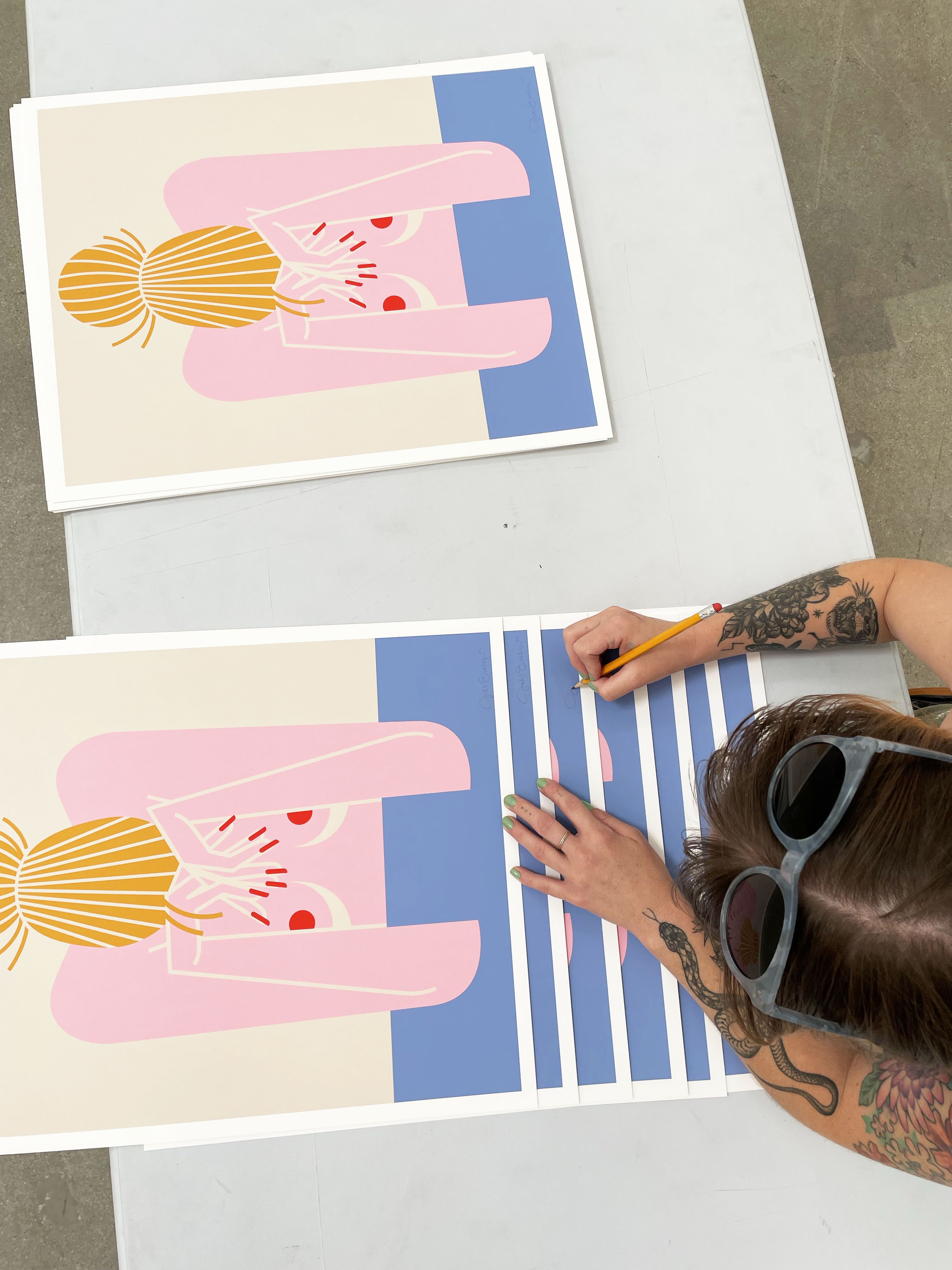 Jillian Evelyn - signing prints pink figure with blue 