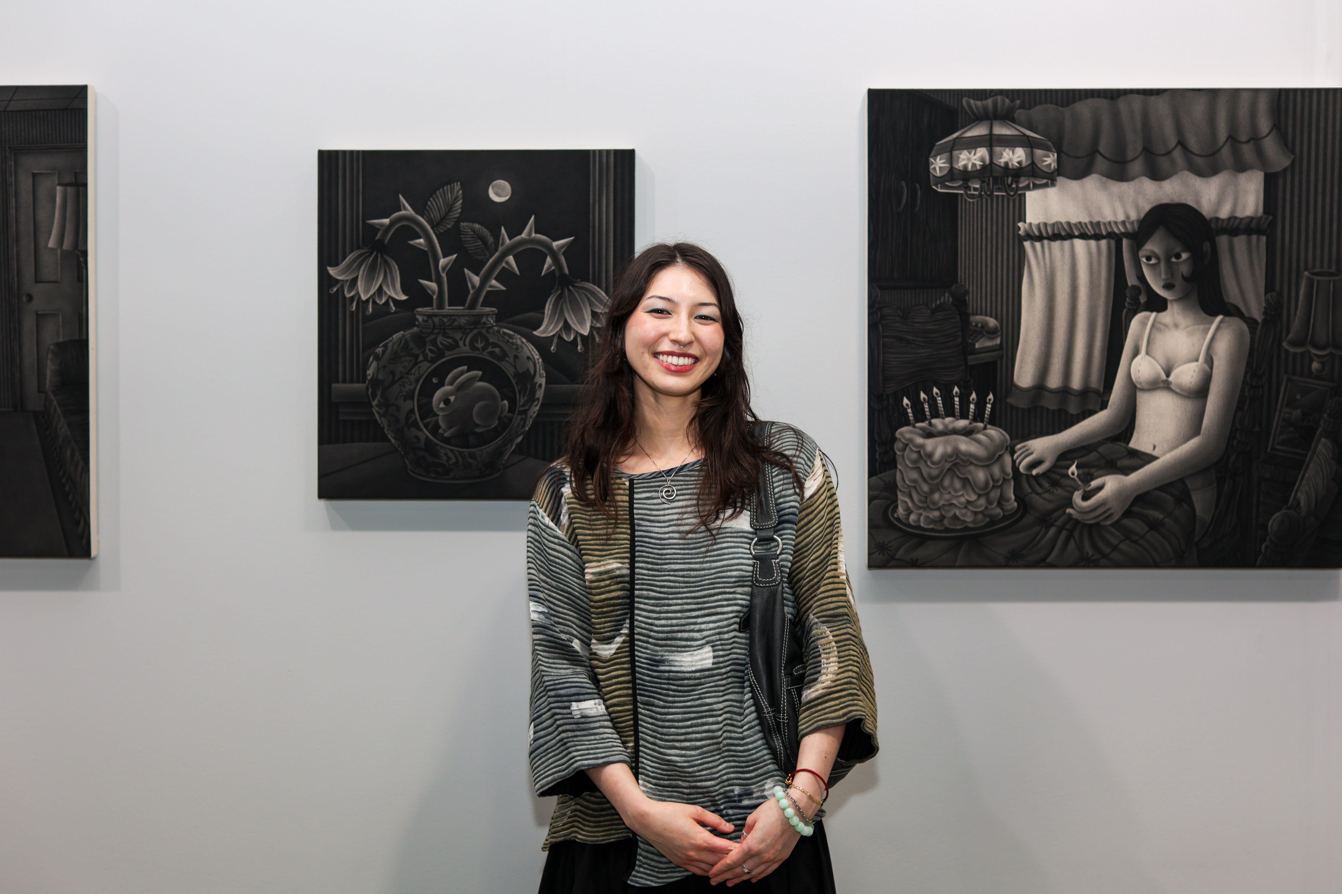Angela Fang Zirbes with her artoworks at Future Fair