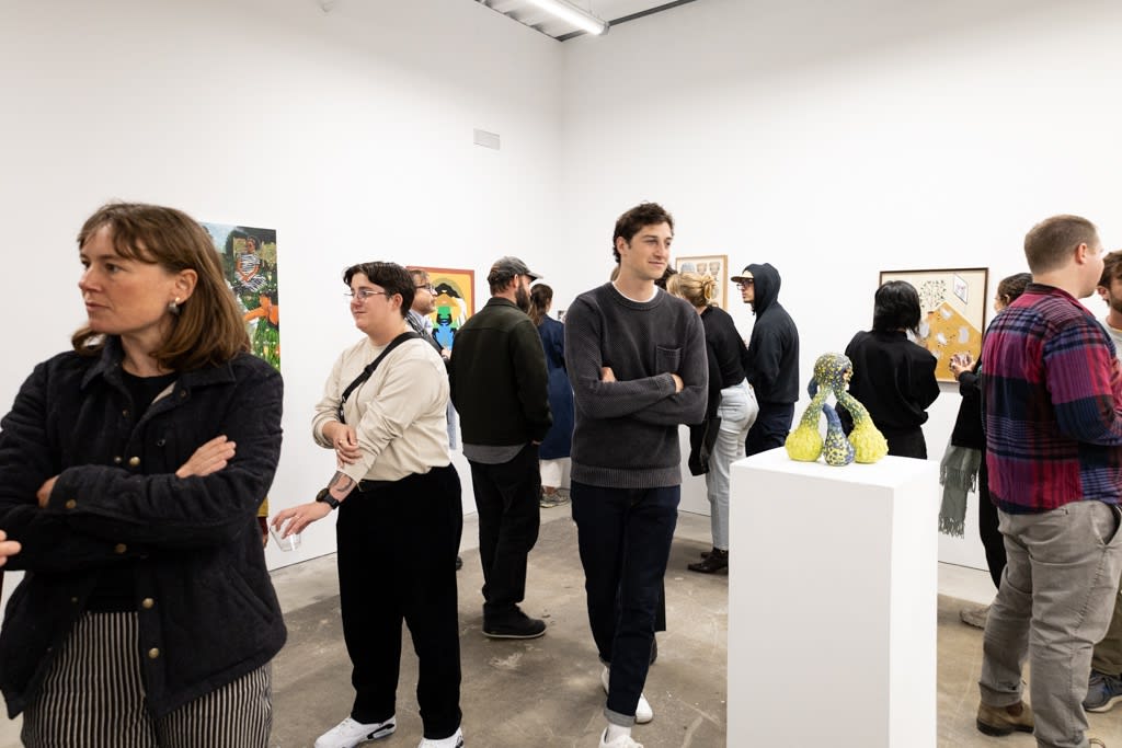 People mingle at the openign reception of Devra Fox's solo exhibition In Orbit. 