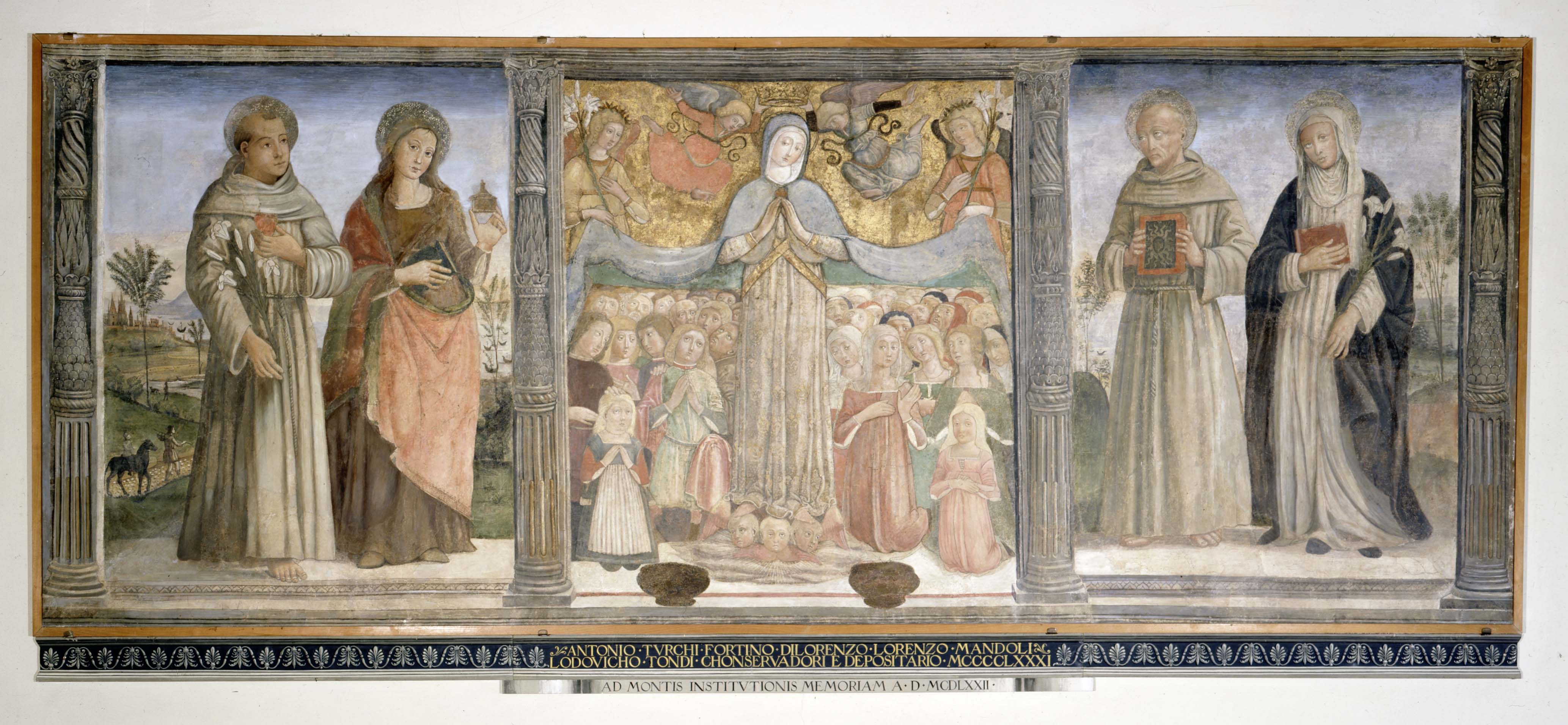 The image is of a large, panoramic fresco or painting divided into three main panels, framed by decorative columns on either side. The left panel shows two saintly figures with halos, one holding a flower and the other a book, set against a landscape backdrop with a figure leading a donkey. The central panel features a religious scene with a gathering of angels and saints around a central figure who appears to be the Virgin Mary, all under a golden, cloud-filled arc. The right panel mirrors the left with two haloed figures, one holding a book and the other gazing directly at the viewer. Beneath the central scene is a Latin inscription, suggesting a dedication or memorial purpose. The painting is rendered in a style that suggests it is from the Italian Renaissance, with attention to detail and a harmonious color palette, conveying a sense of serenity and sacredness.