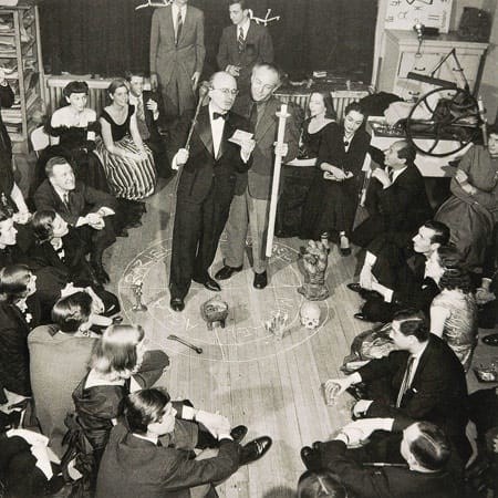 Photograph of a “Magic Evening” (“Soirée Seligmann”) in Kurt Seligmann’s New York studio, 1948. Kurt Seligmann and Enrico Donati in a magic circle. Photograph by Bernard Hoffman.