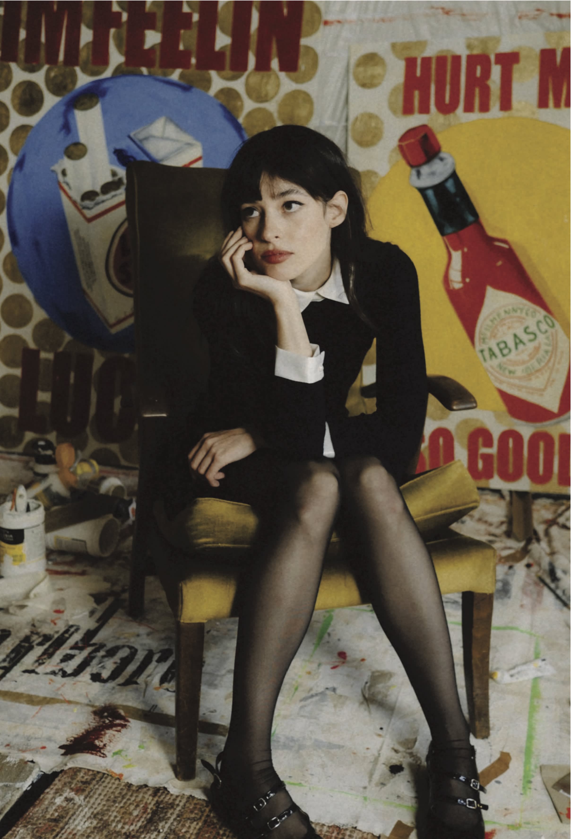 Emerging female artist Charlotte Rose is shown in her art studio, surrounded by her rebellious and nostalgic pop art paintings.